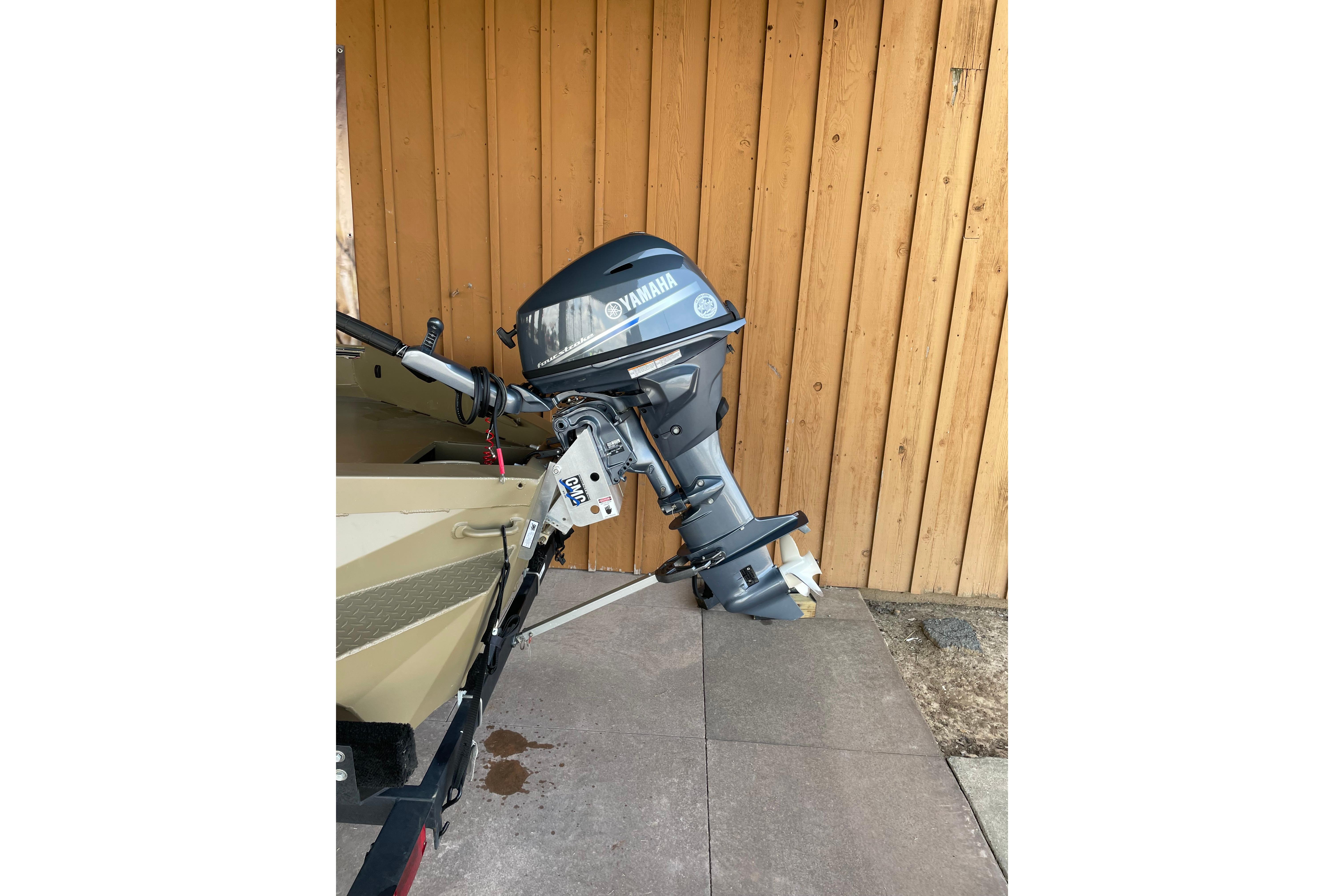 2025 Edge Duck Boats 550 with Yamaha outboard motor, parked by wooden wall.