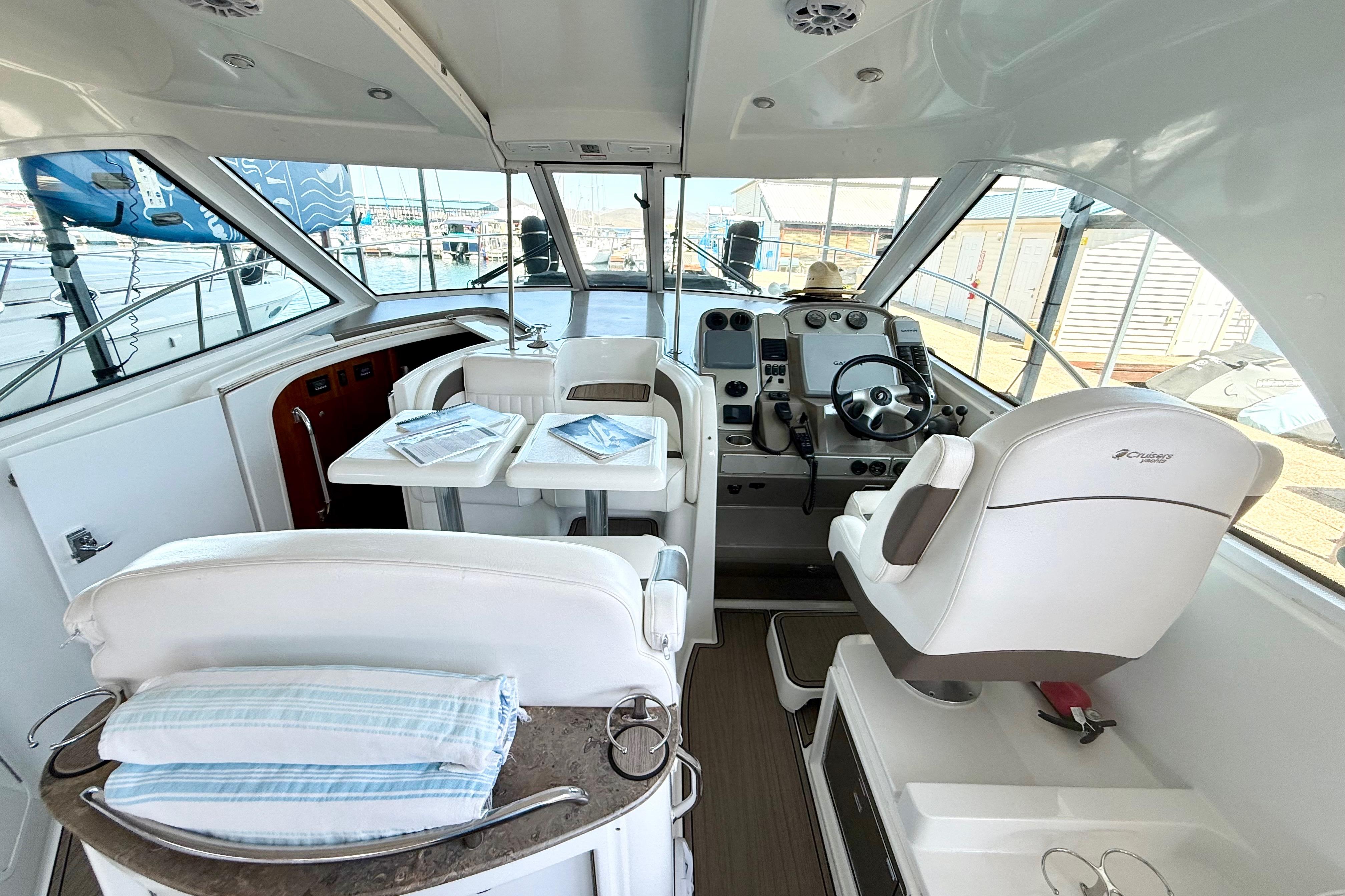 Interior of 2011 Cruisers Yachts 390 Sports Coupe with helm and seating area.