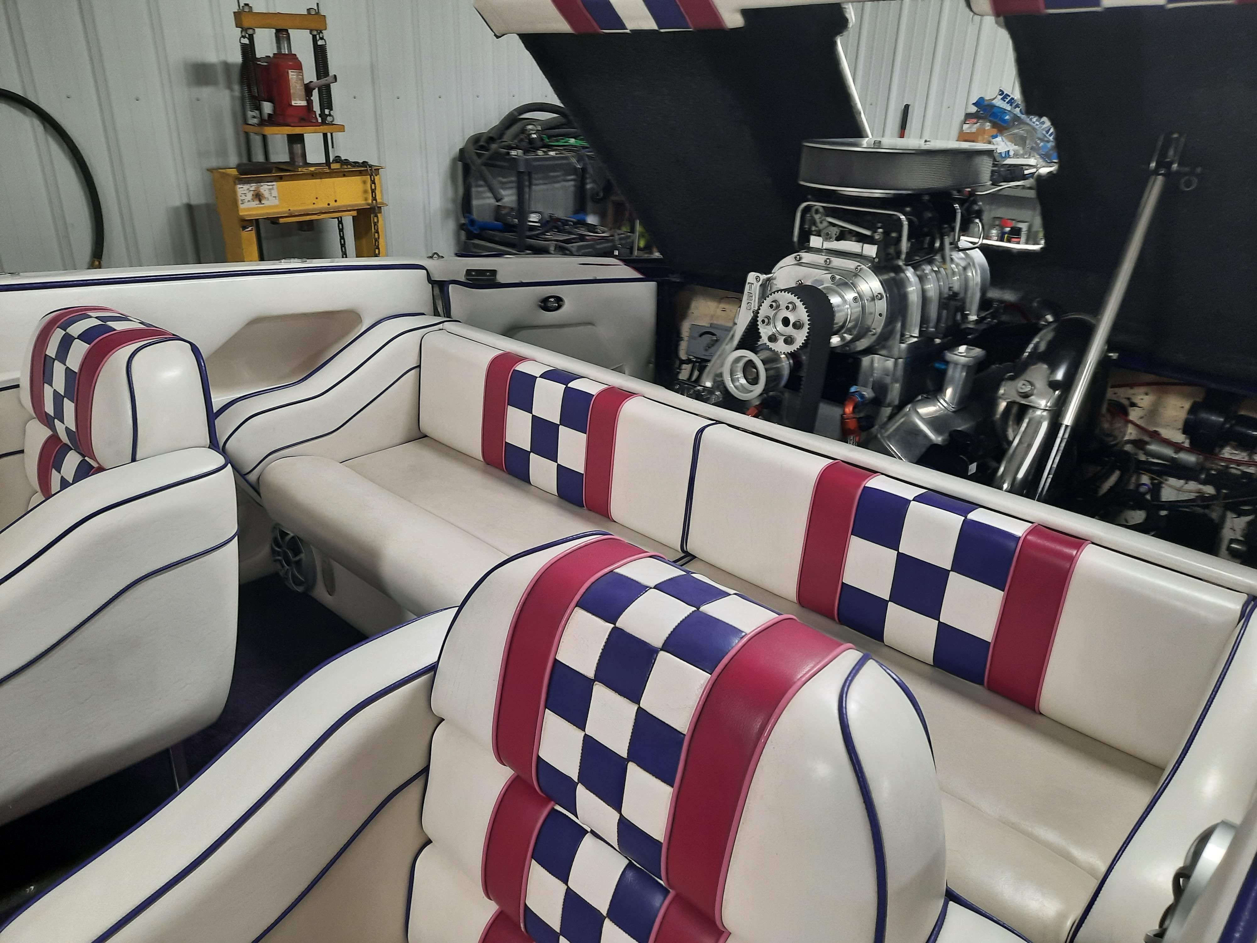 Interior of 1999 Eliminator 25ft Catamaran with checkered seats.