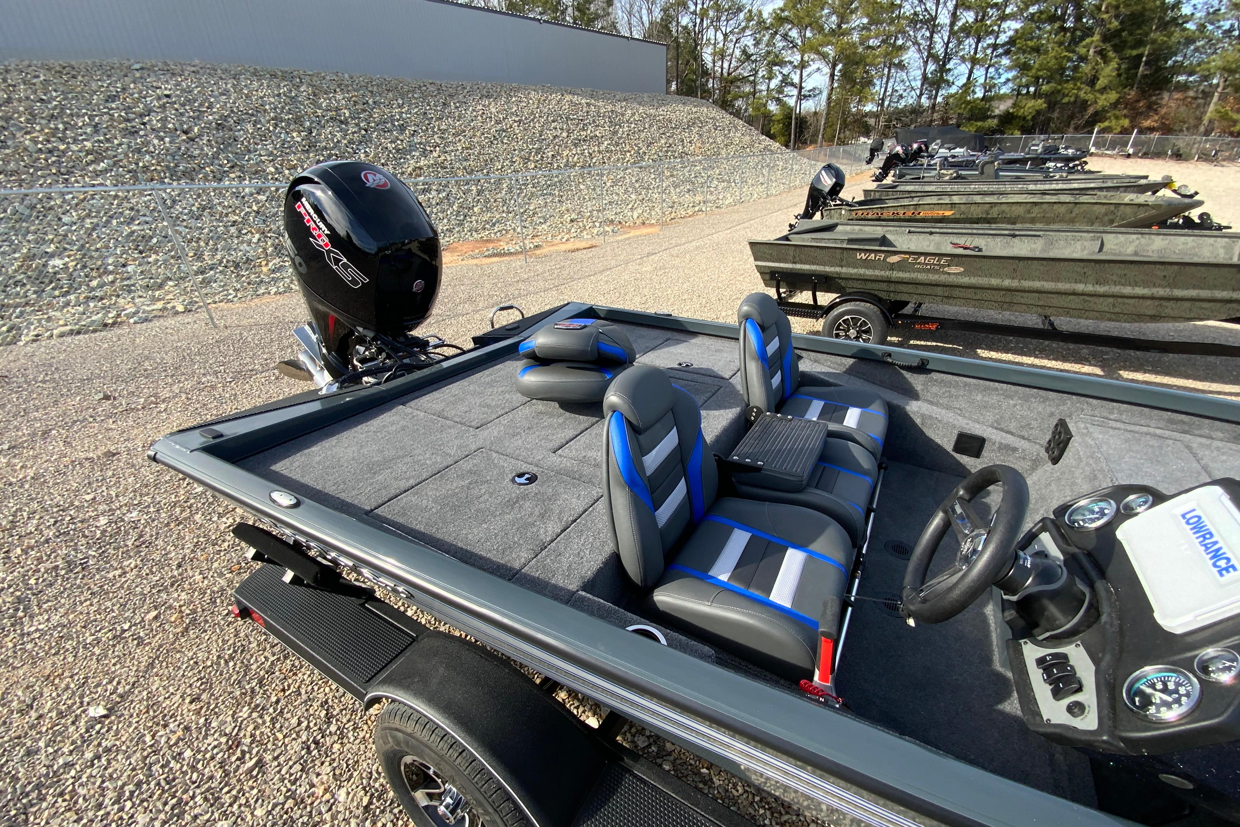 2026 Ranger RT198P fishing boat with modern seating and powerful outboard motor.