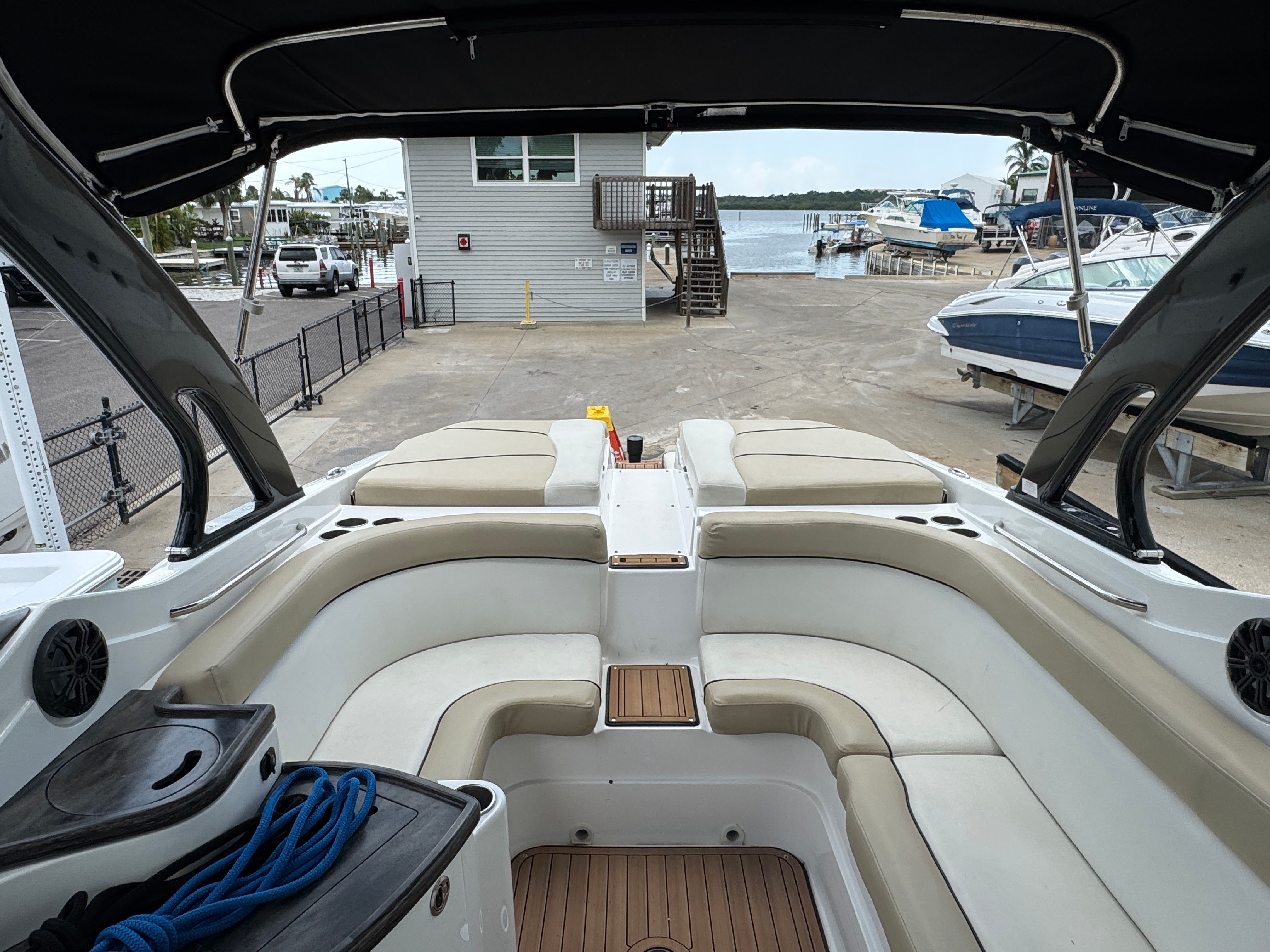 Interior of a 2017 Rinker QX29 BR boat at the marina.
