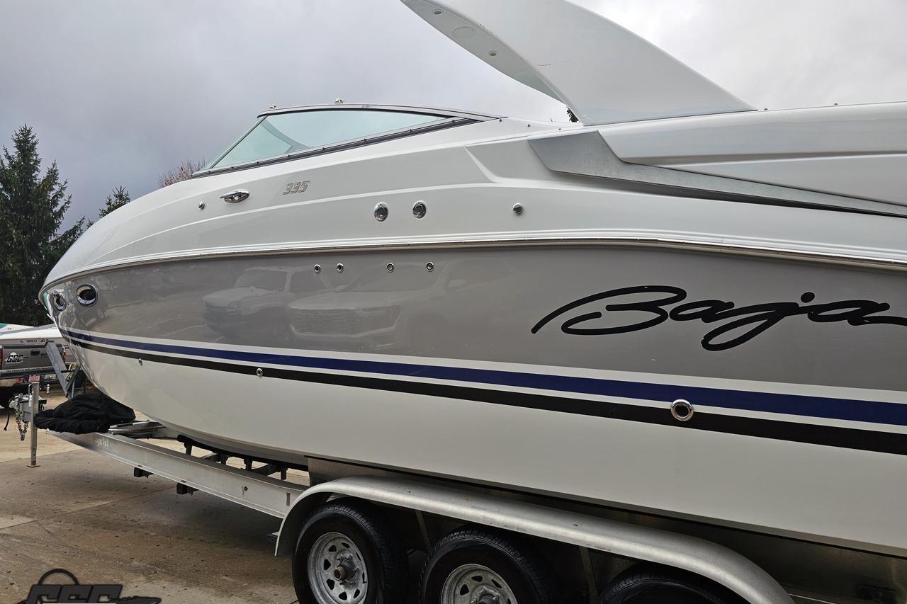 2008 Baja 335 Performance boat on trailer, showcasing sleek design and branding.