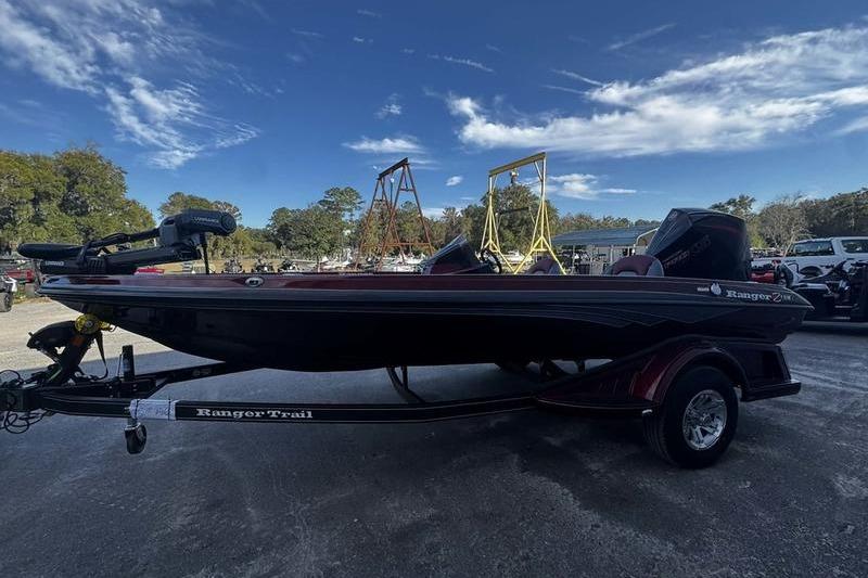 2026 Ranger Z518 Cup-Equipped boat on trailer under blue sky.