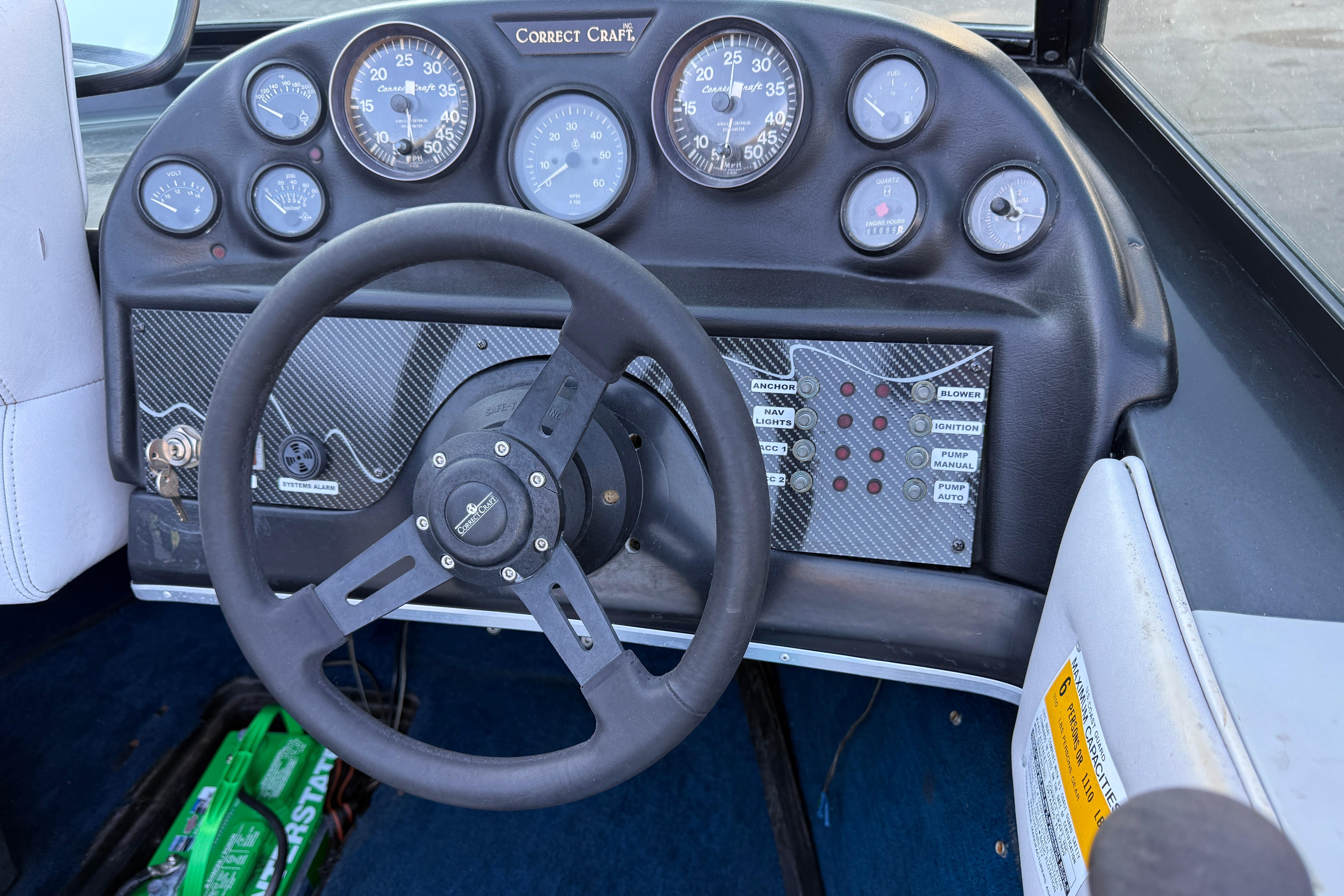 1989 Correct Craft Ski Nautique dashboard with steering wheel and instrument panel.