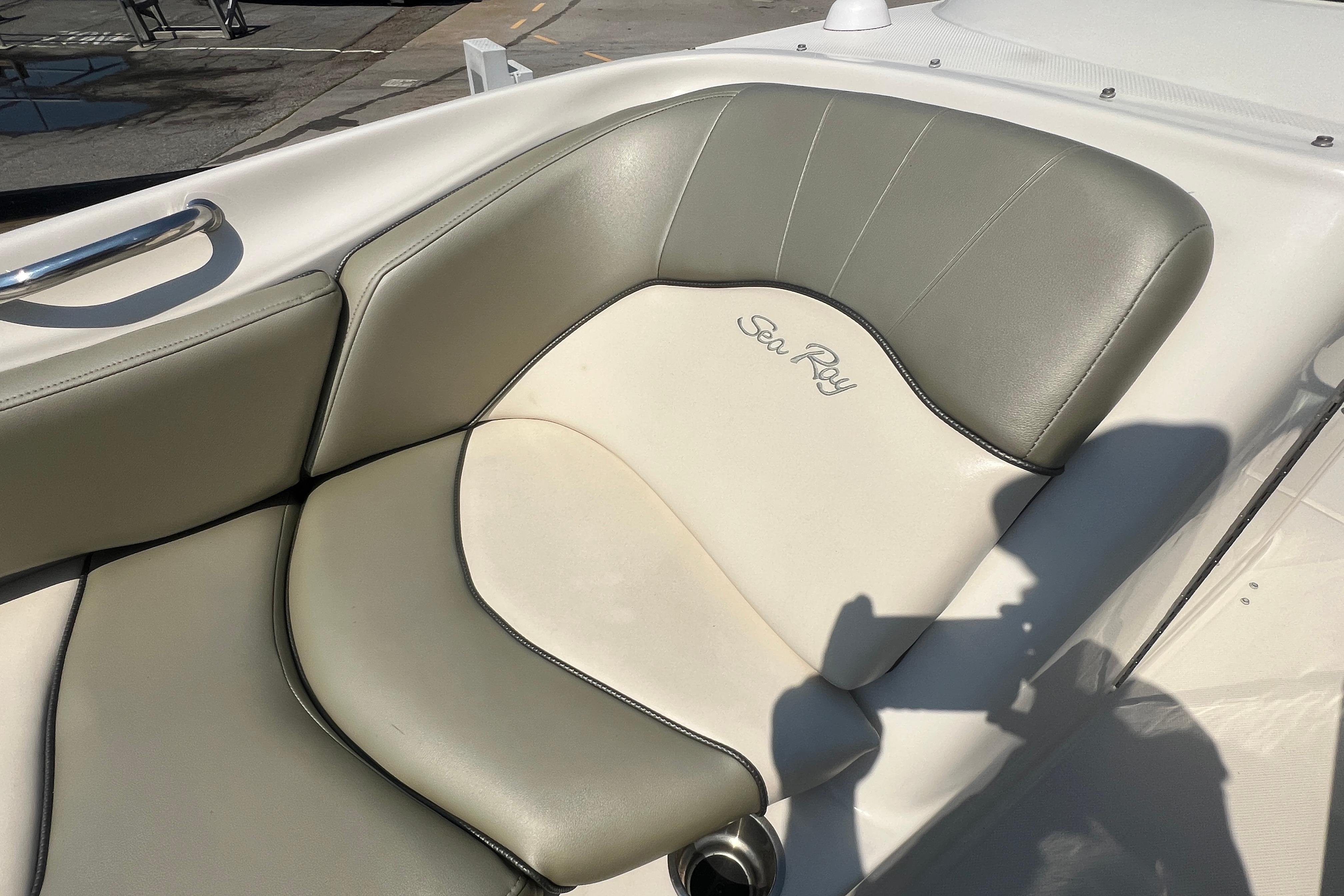 2005 Sea Ray 240 Sundeck boat seat with gray and white upholstery.