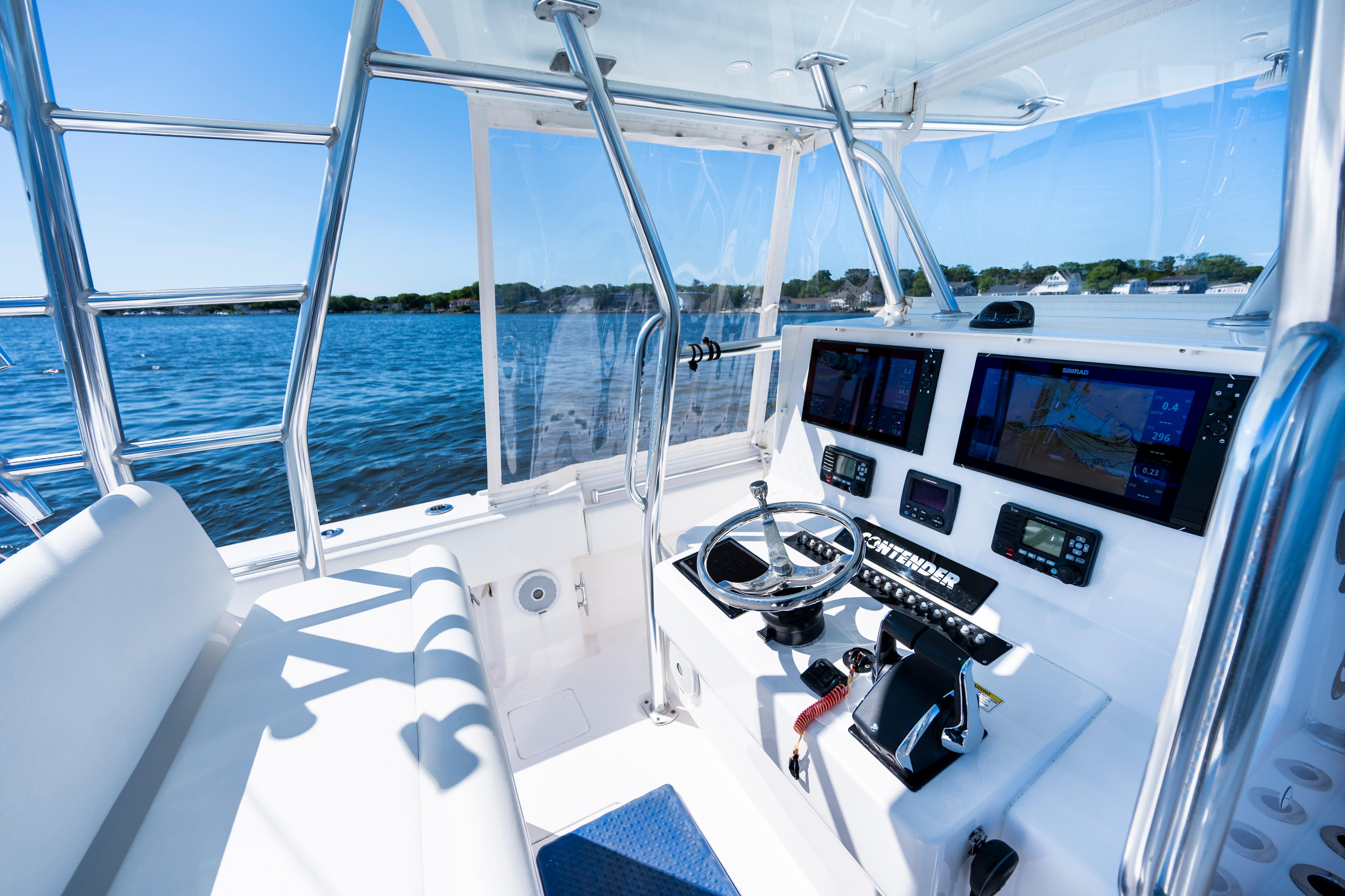 2015 Contender 39 ST boat cockpit with advanced navigation systems and ocean view.