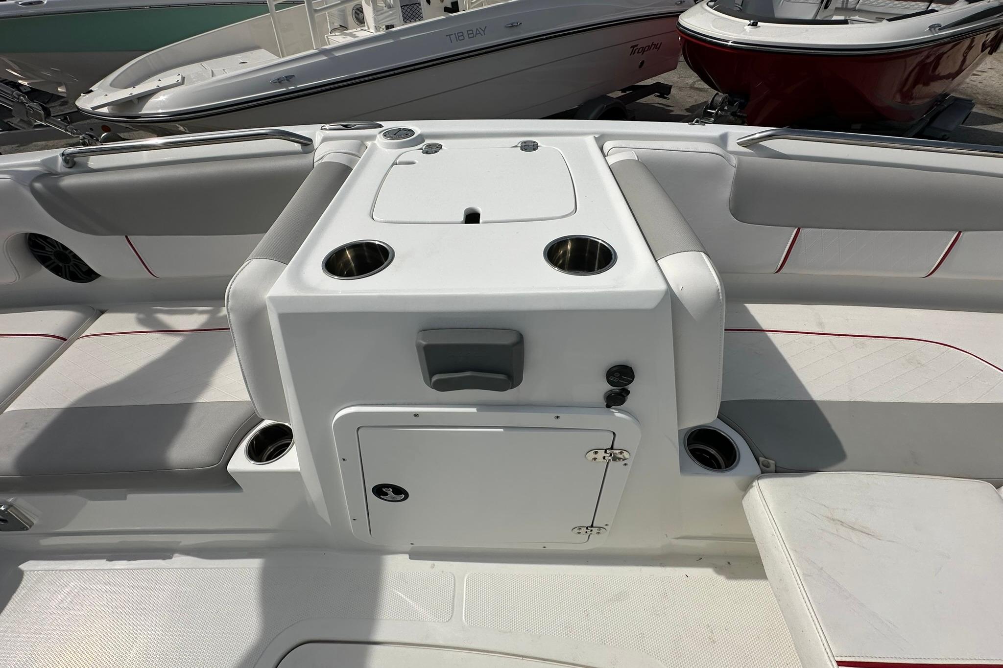 2021 Tahoe 2150 boat interior with seating and cup holders.