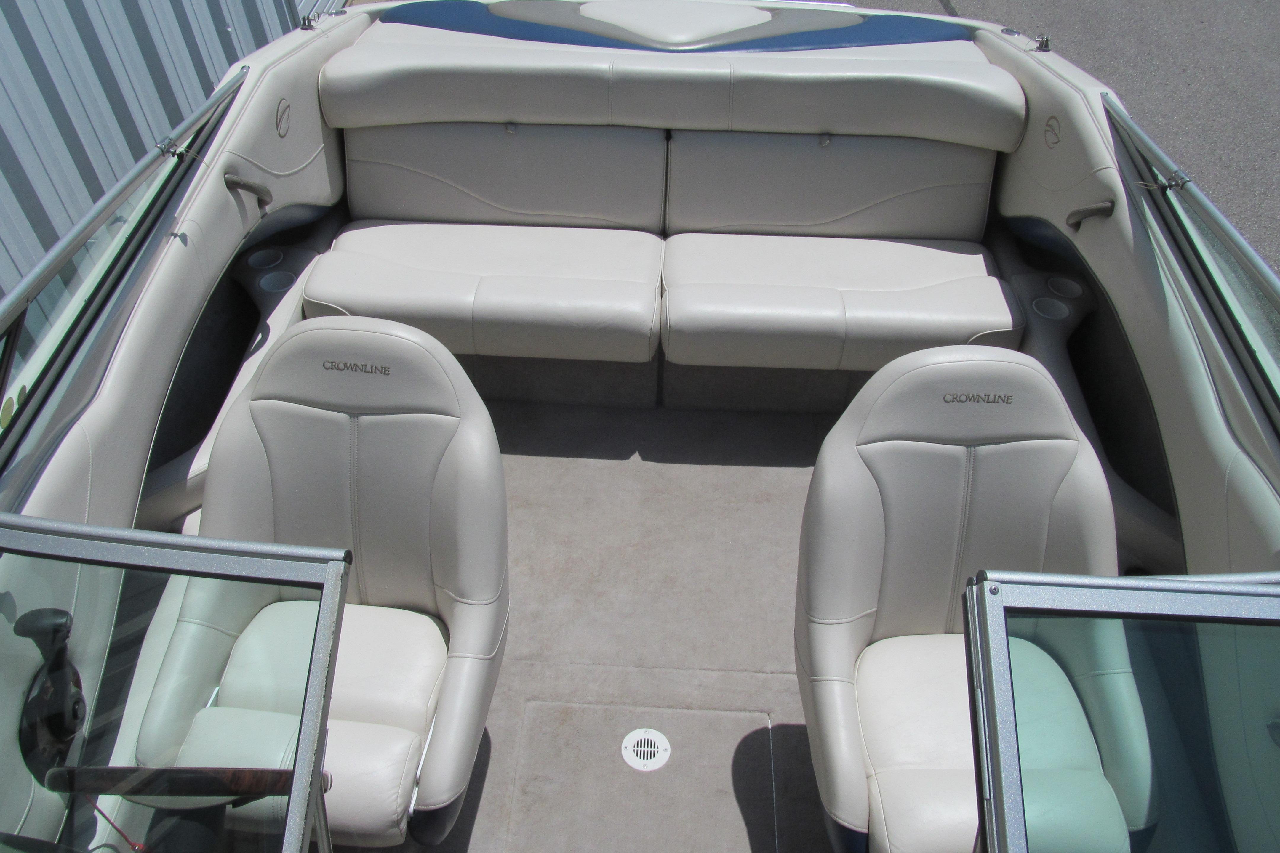 Interior of a 2001 Crownline 225 BR boat with white leather seating.