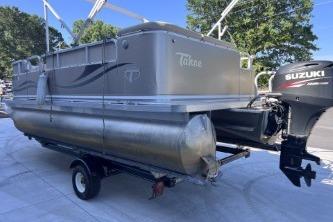 2012 Avalon Tahoe pontoon boat with Suzuki outboard motor on trailer.