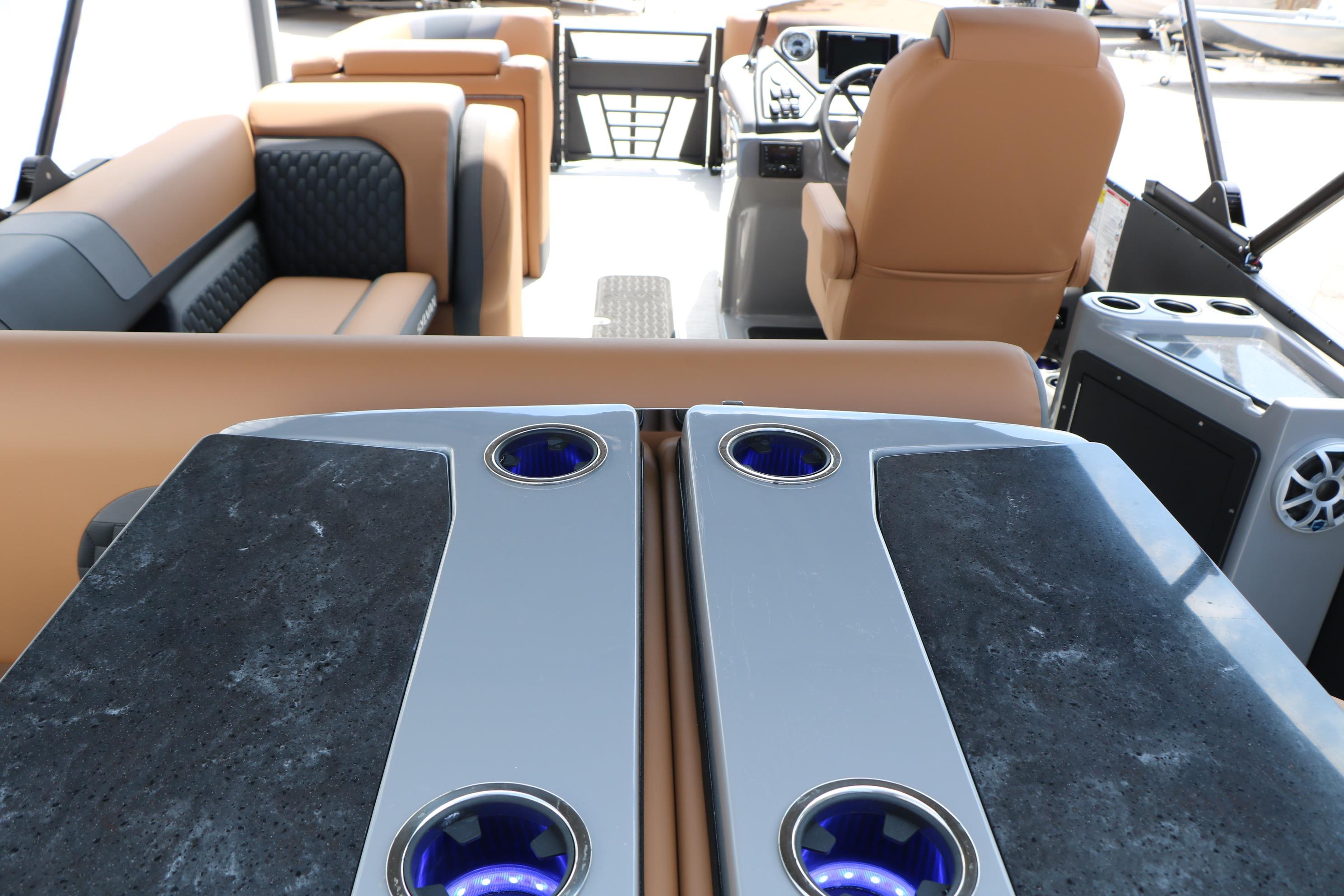 Luxurious interior of 2026 Sylvan L3 DLZ Bar Platinum Edition Tri-Toon with elegant seating.