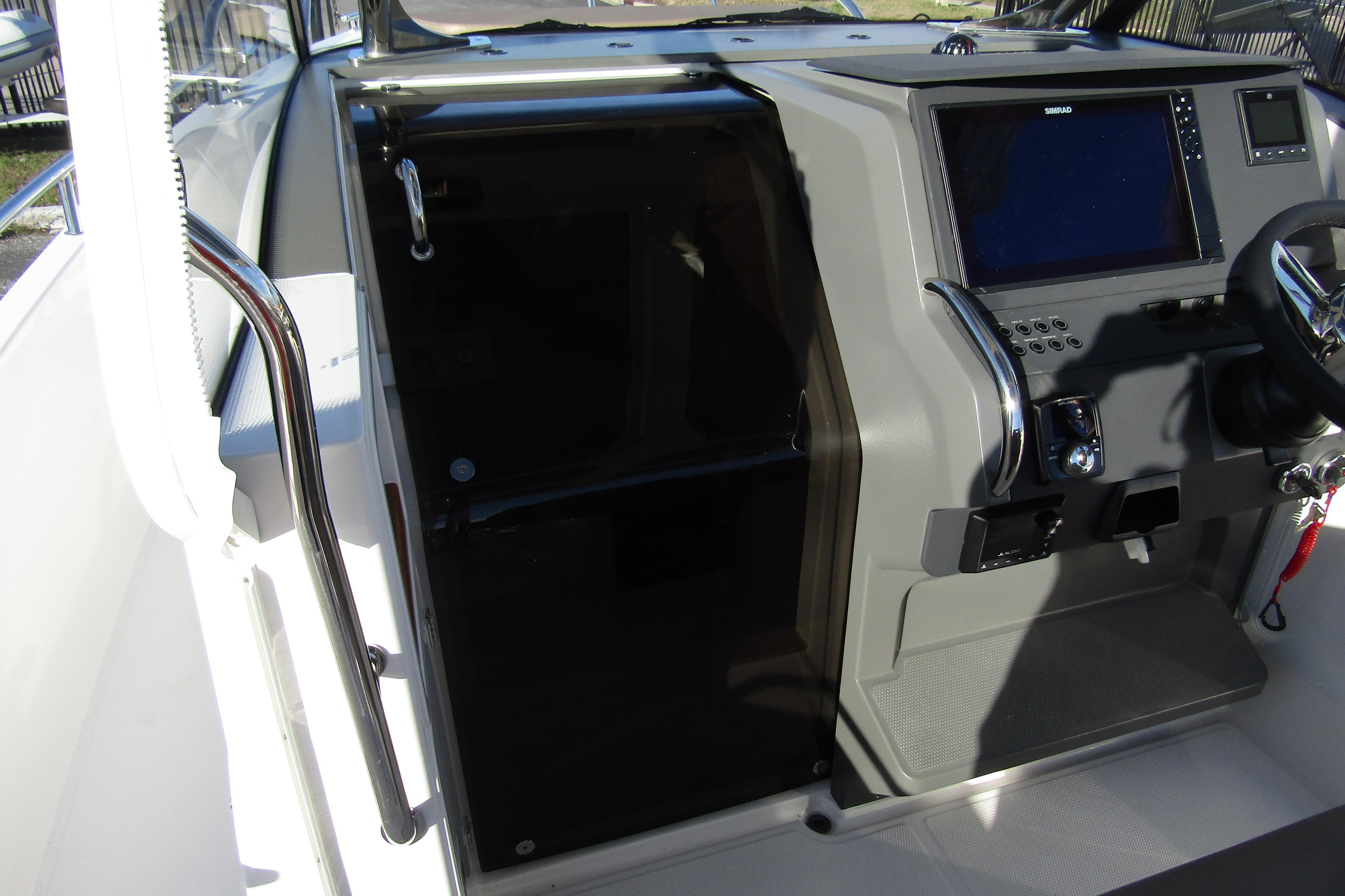 Interior view of 2025 Nimbus Tender 9 boat cockpit with control panel.