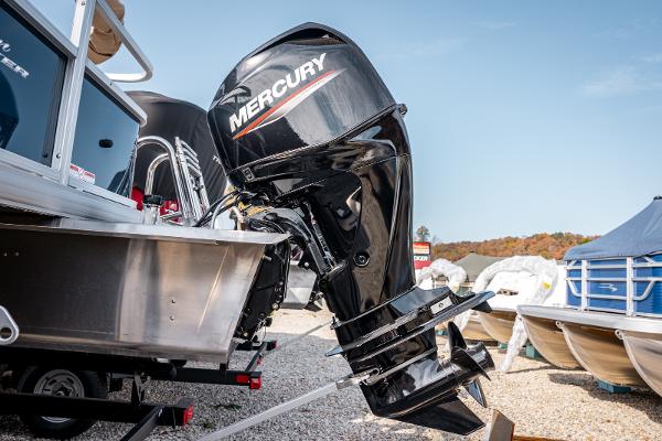 2025 Sun Tracker BASS BUGGY 18 with Mercury outboard motor in a boatyard.