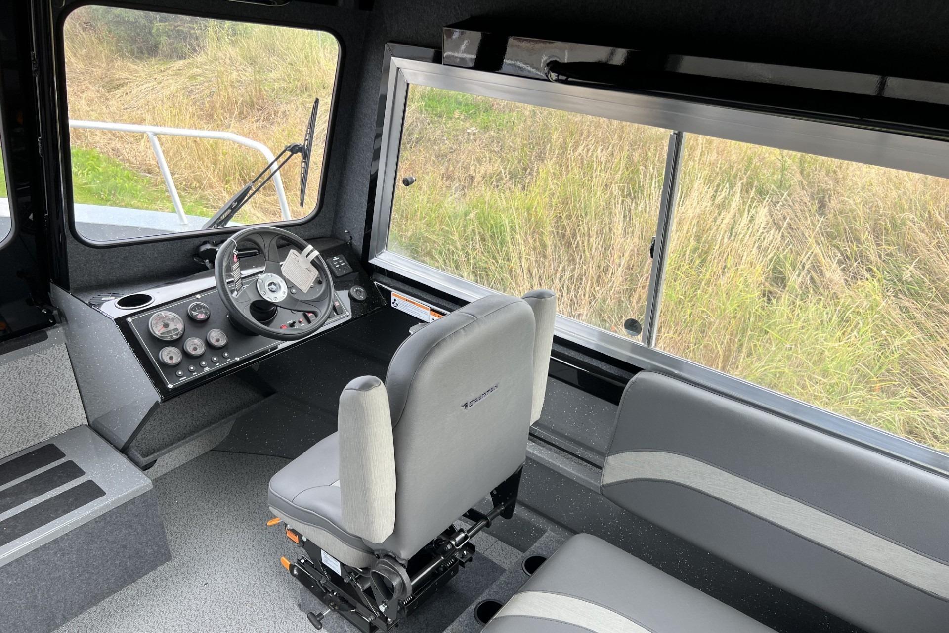 2024 Spartan 220 Maximus interior with steering wheel, dashboard, and seating.