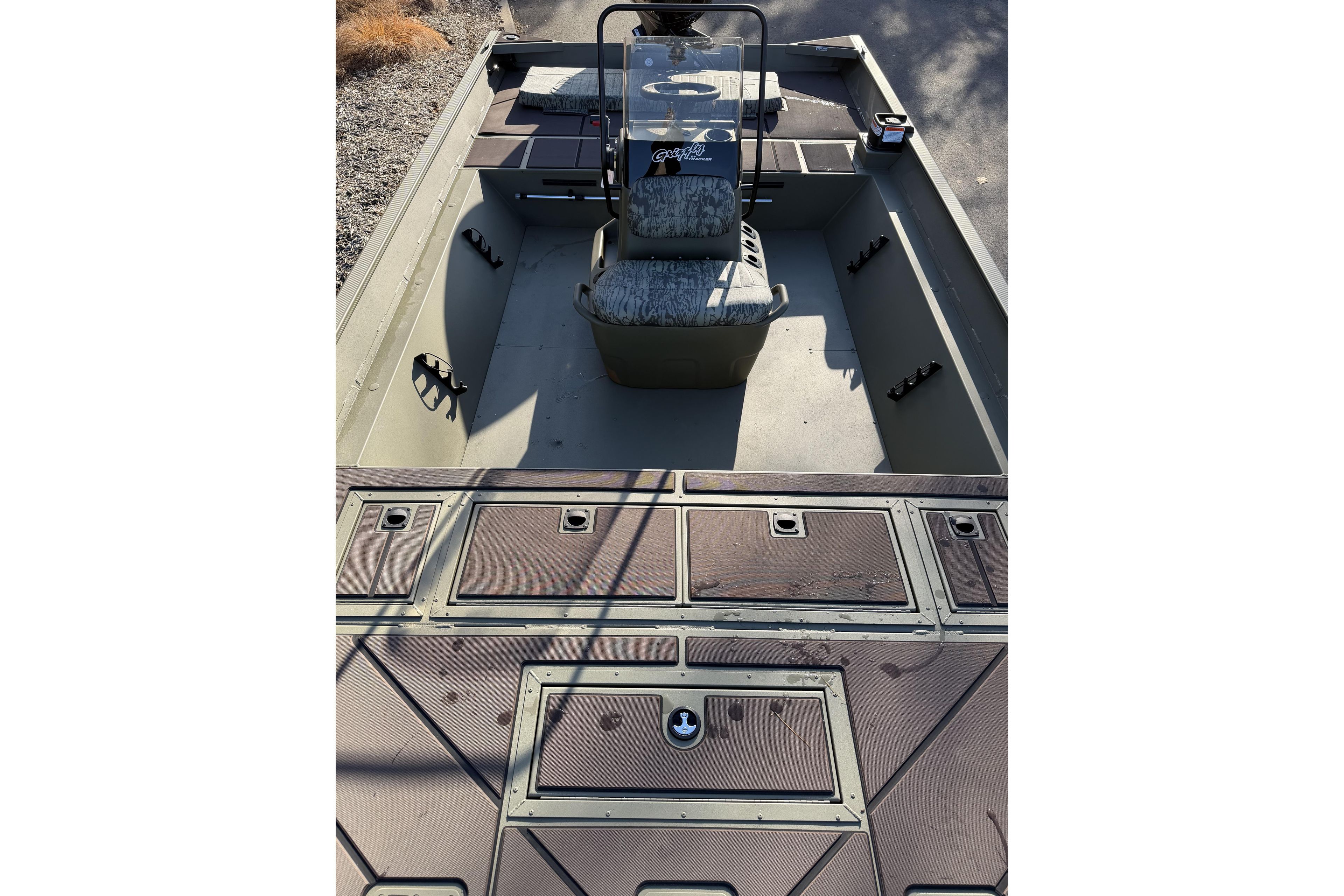 2026 Tracker Grizzly 2072 CC boat interior with seating and storage compartments.