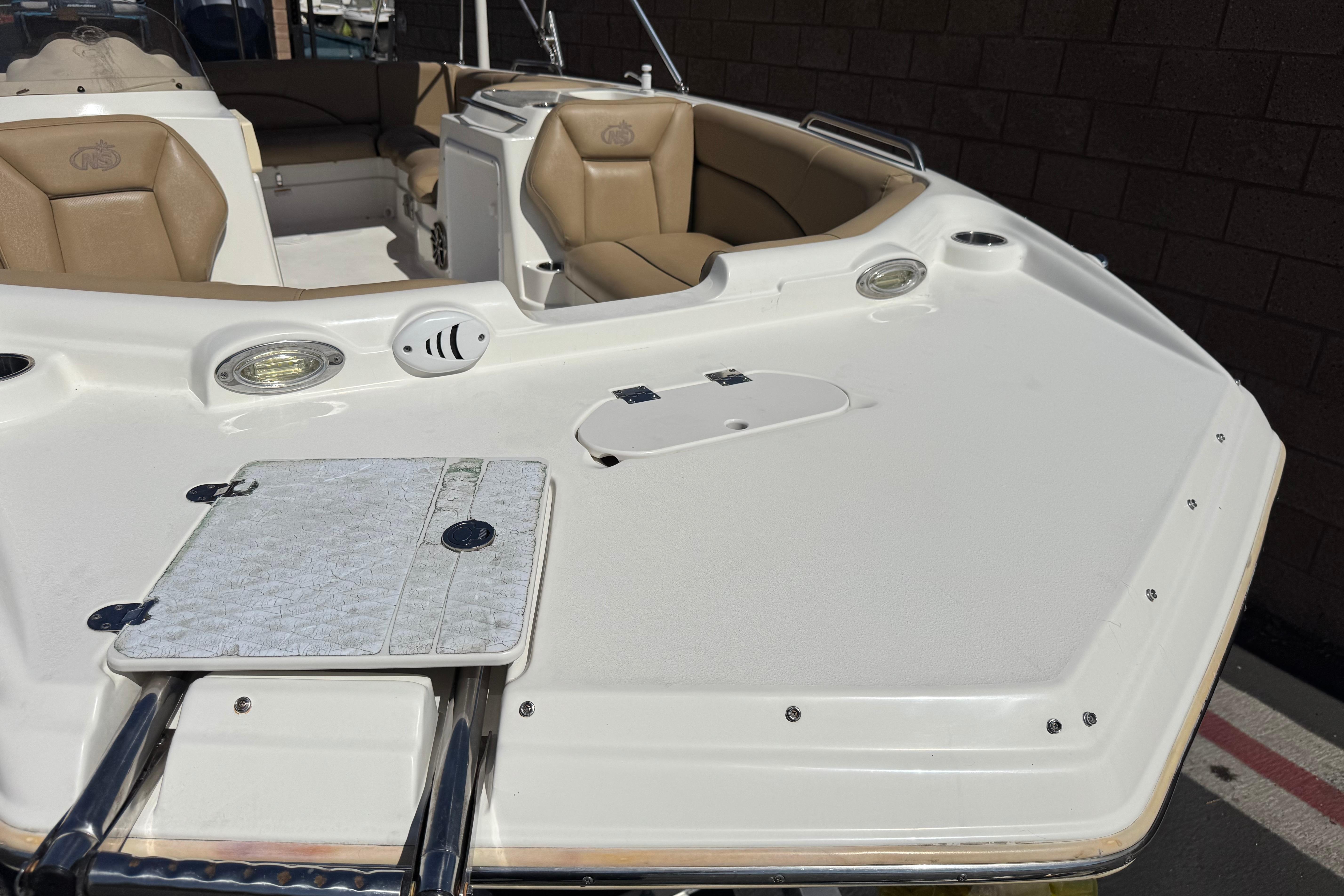 2020 NauticStar 203 SC boat interior with tan seating and white deck.