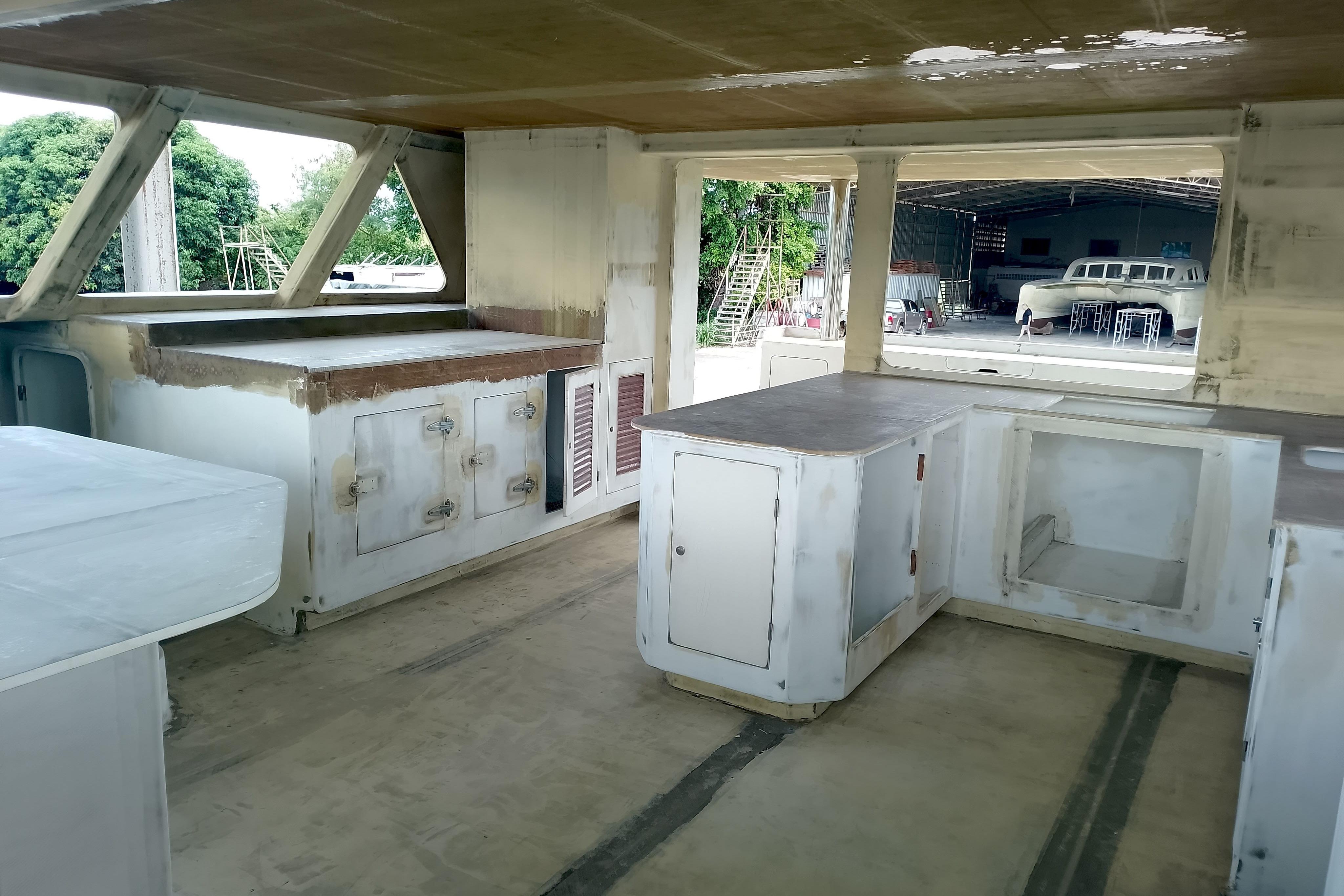 Interior view of 2026 Schionning Prowler 1500 catamaran under construction.