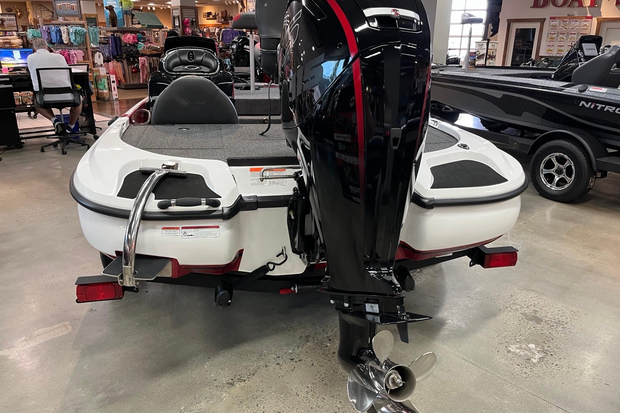 2026 Nitro Z17 boat in showroom, rear view with motor and propeller.