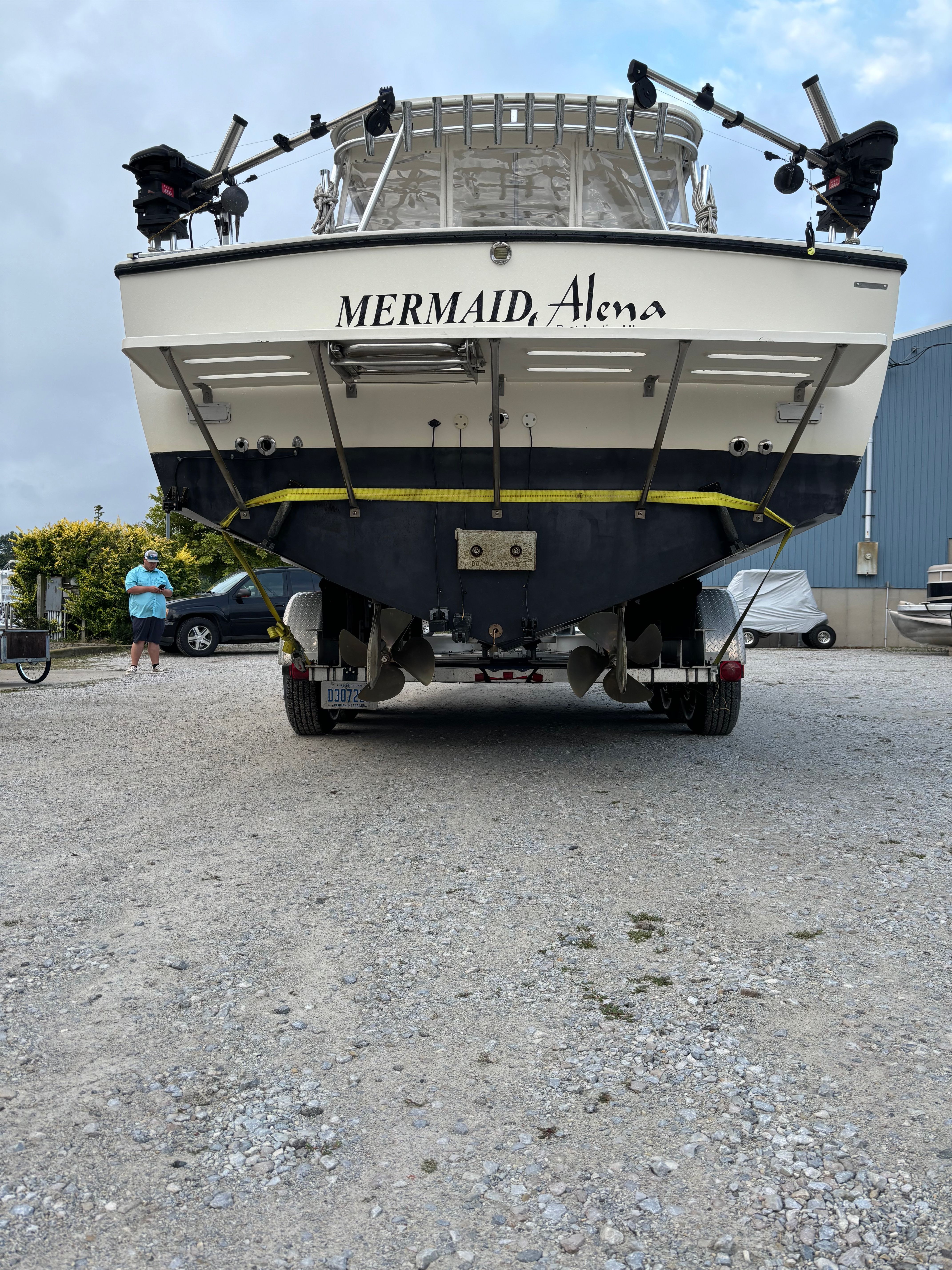 Rear view of a 2004 Carolina Classic 28 Express boat on trailer.