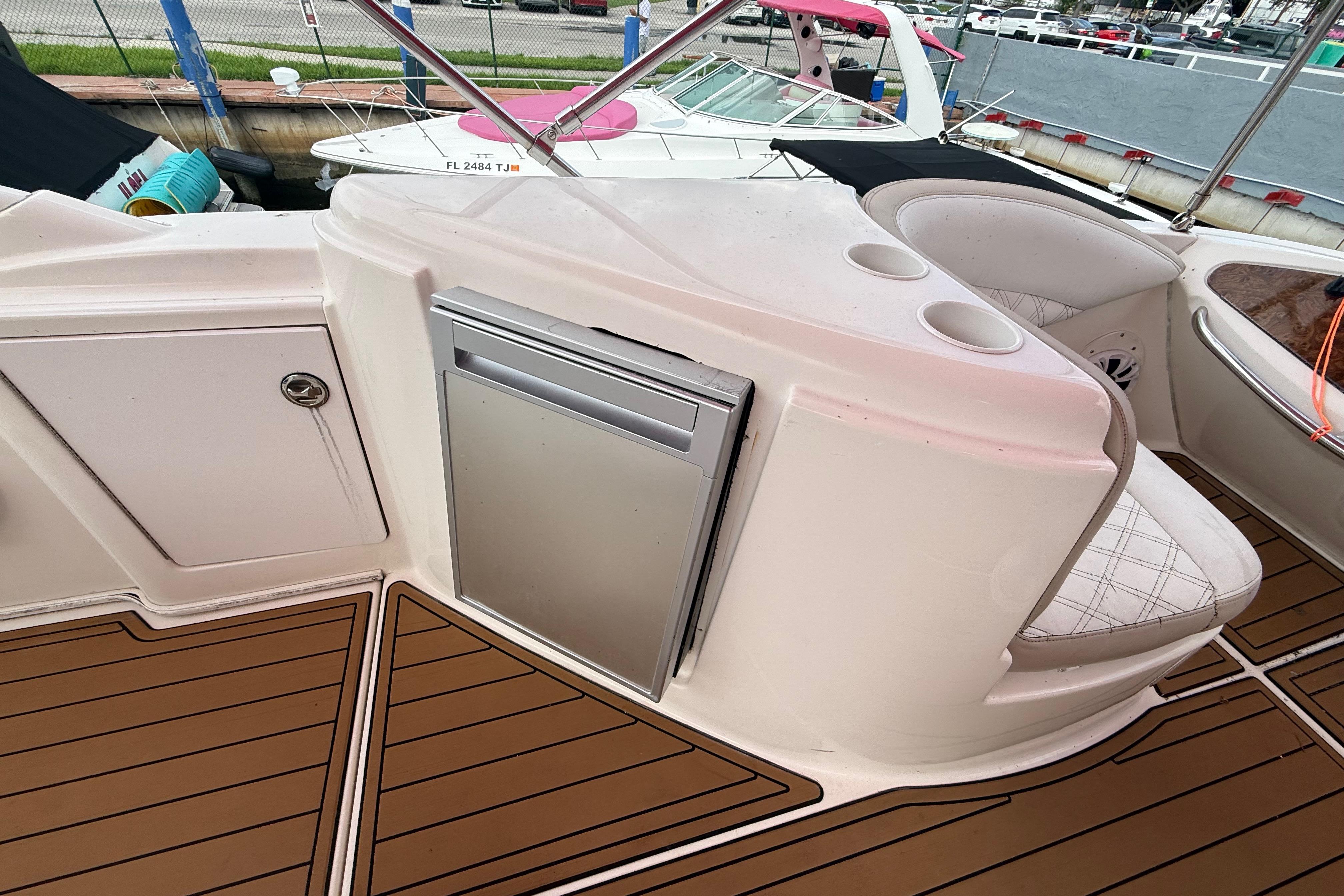 2007 Meridian 459 Motoryacht interior with seating, storage, and cup holders.