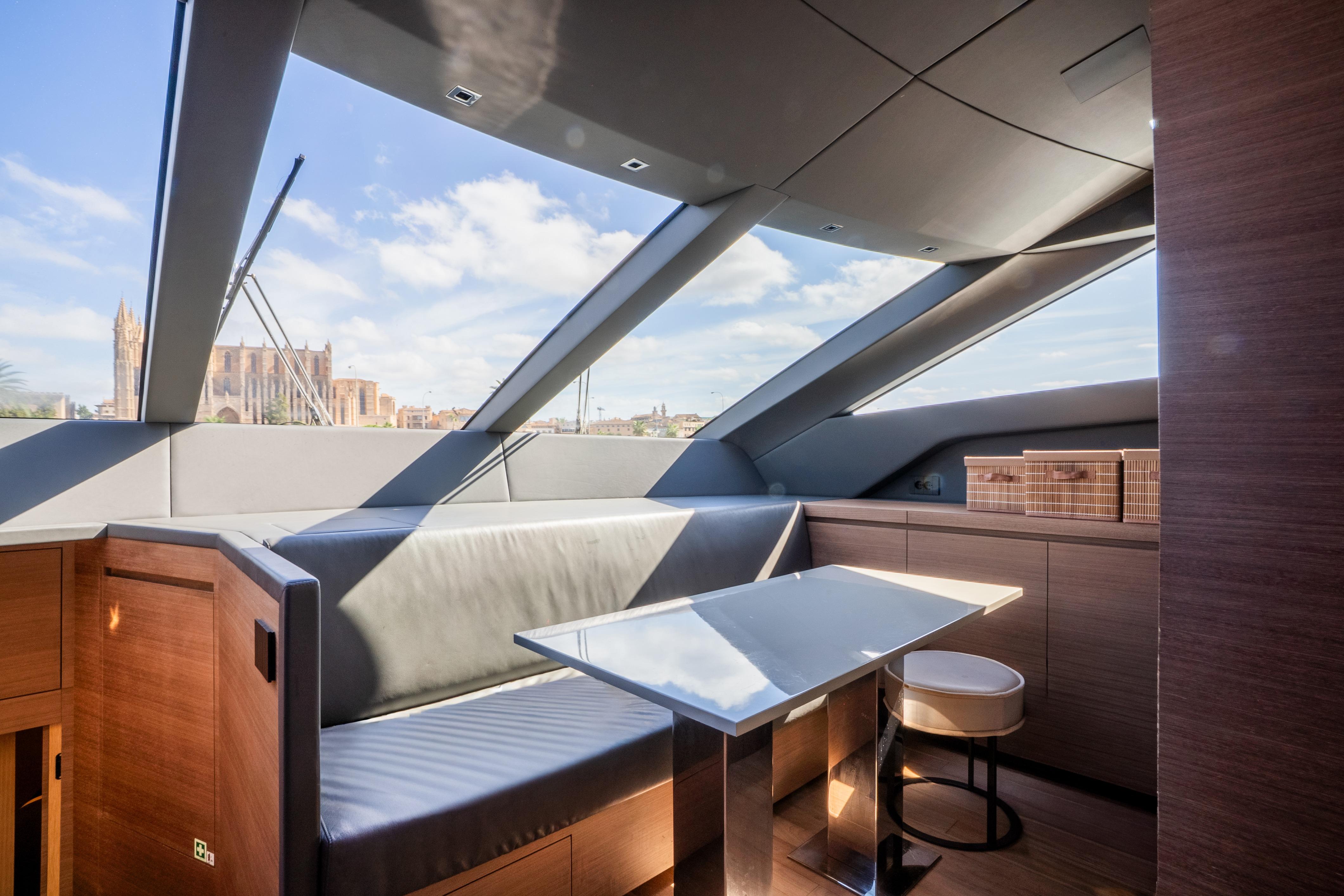 Luxurious interior of 2024 Sanlorenzo SL86 yacht with modern seating and panoramic windows.