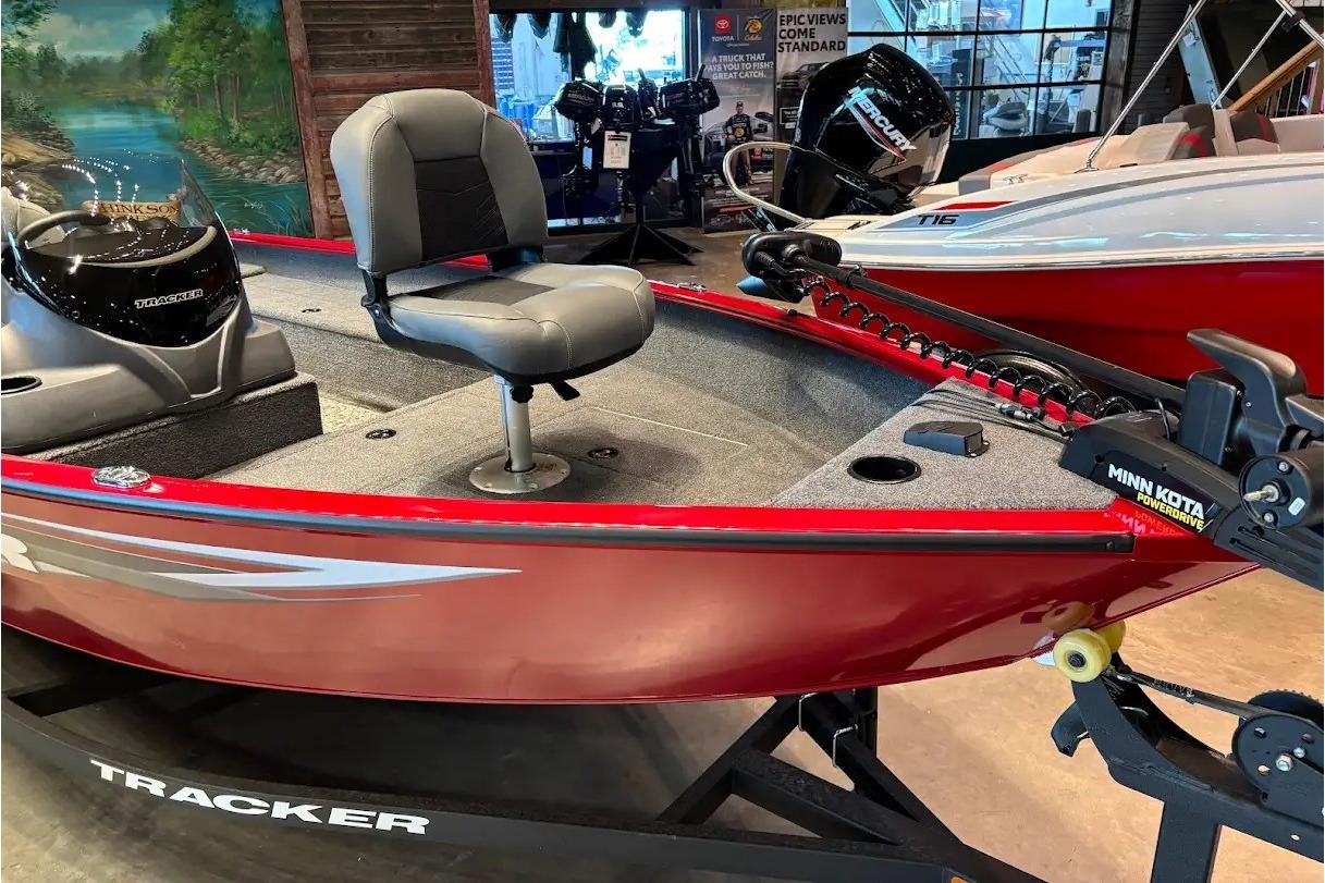 2026 Tracker Super Guide V-16 SC boat with Minn Kota PowerDrive, displayed indoors.