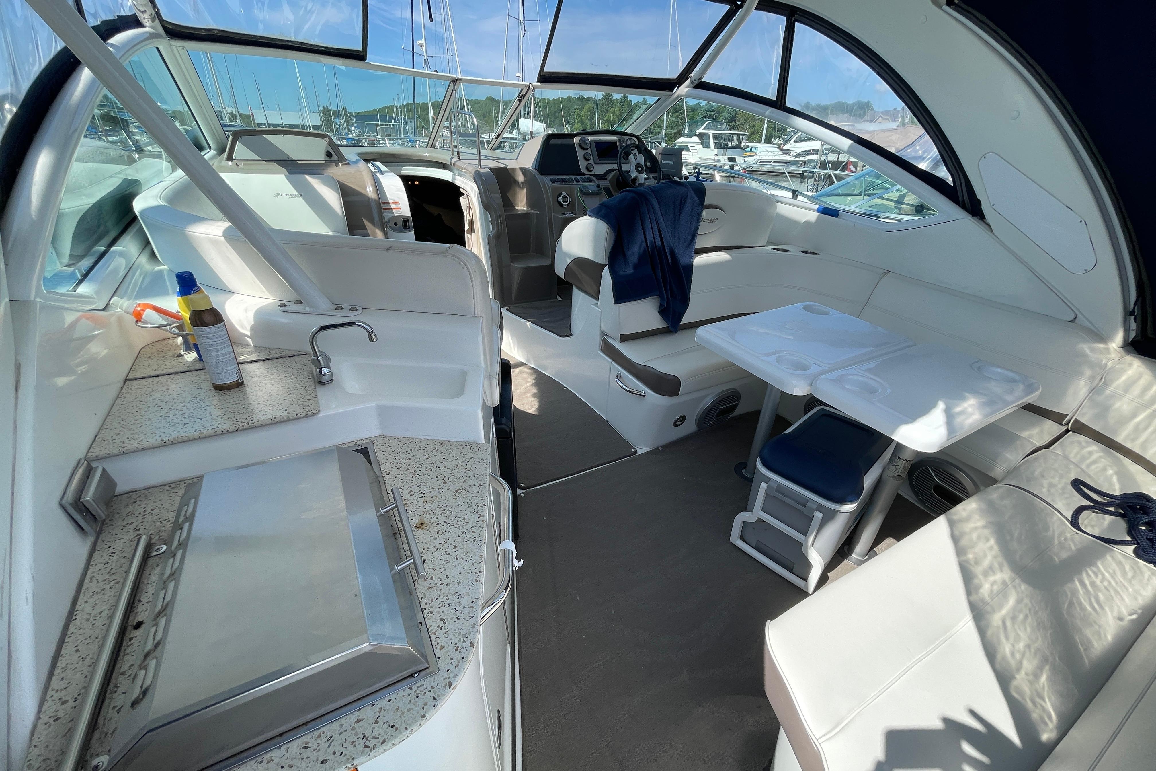 Interior of 2011 Cruisers Yachts 360 Express with seating, table, and kitchenette.