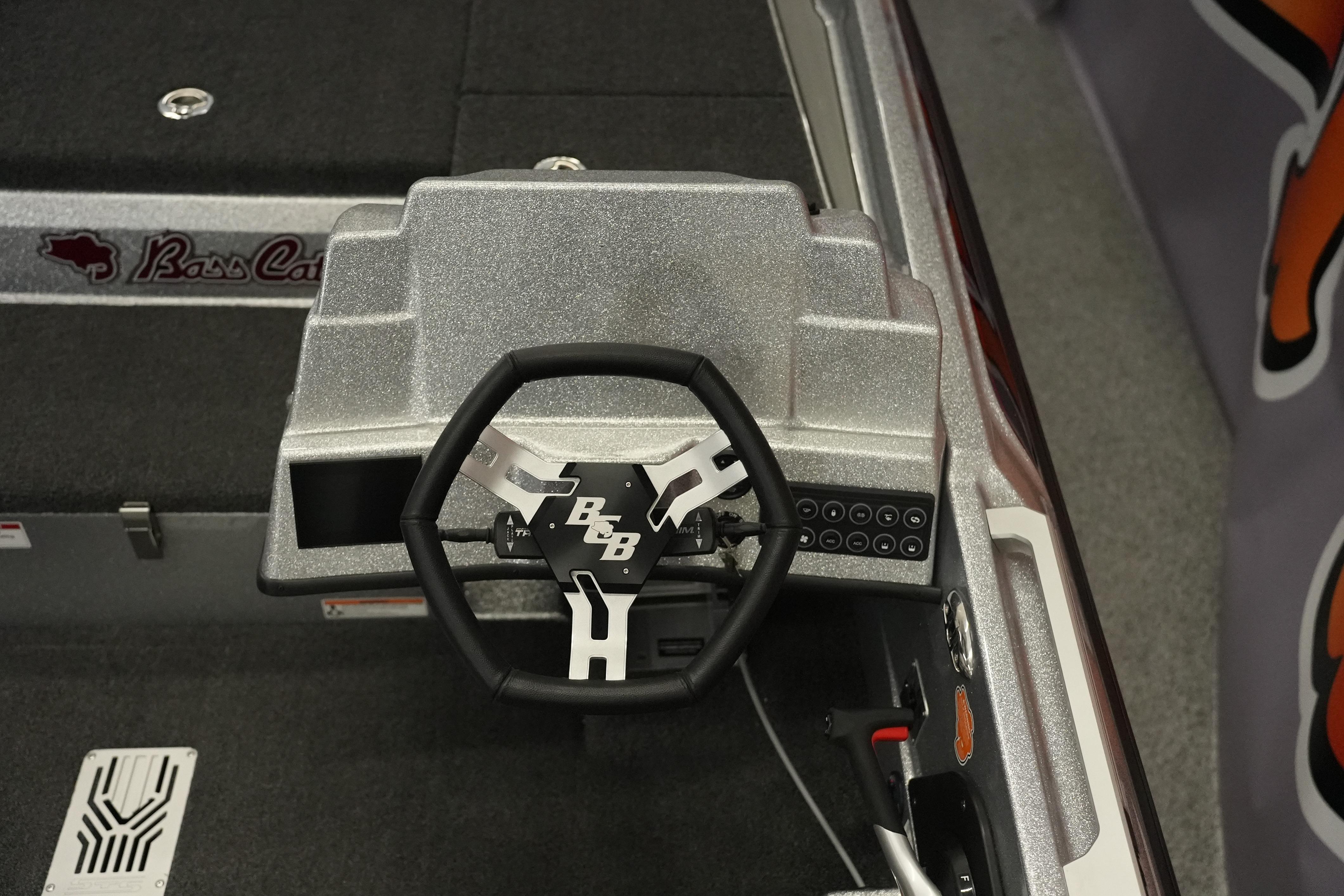 Steering console of 2026 Bass Cat Lynx STS boat with modern design and controls.