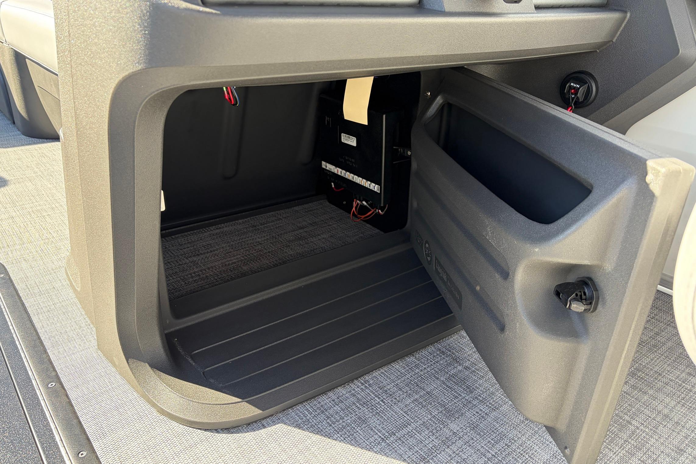 Open storage compartment on 2026 Sun Tracker Party Barge 22 RF XP3 boat.
