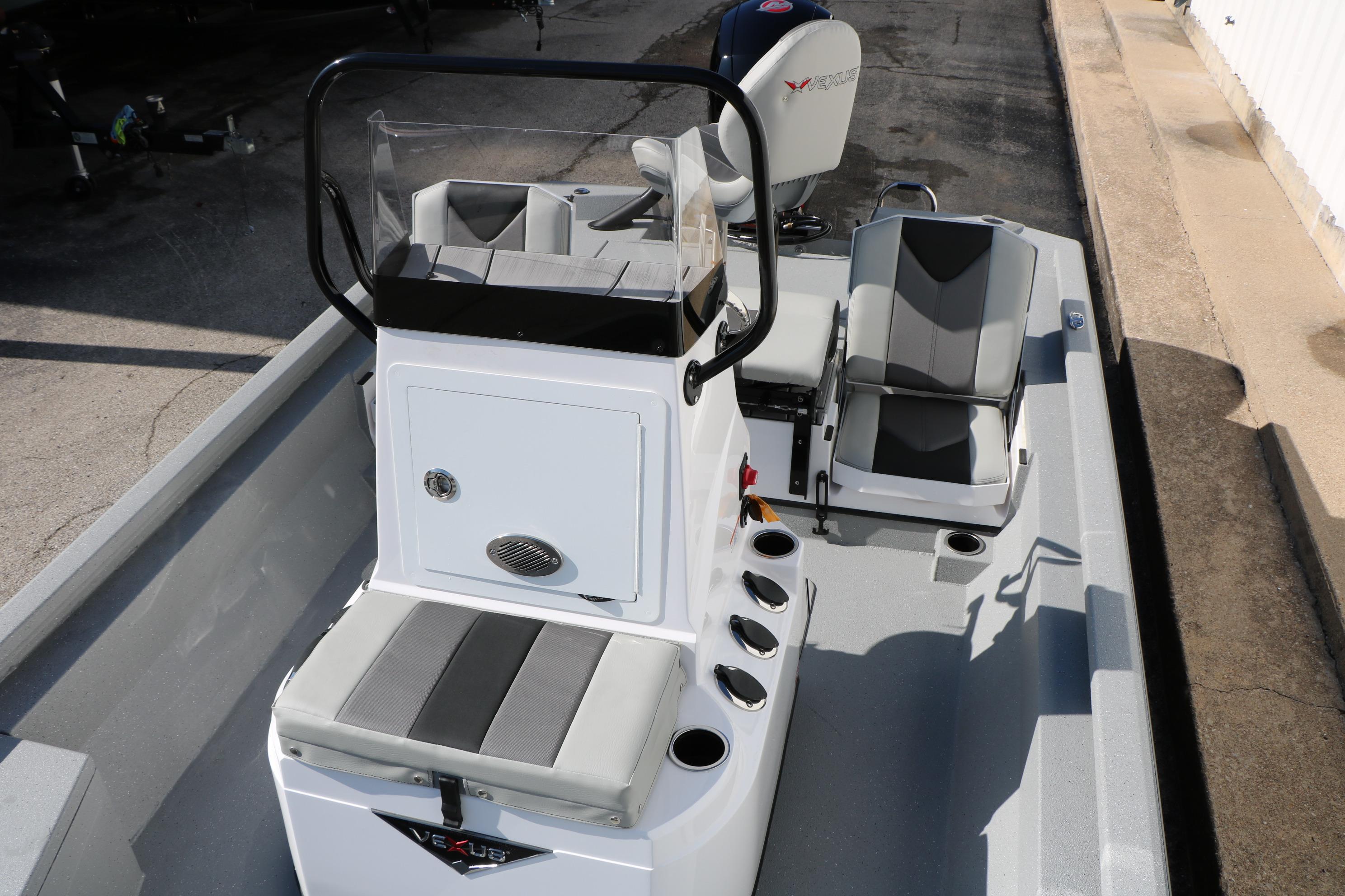 2026 Vexus ACX2000 boat interior with seating and console, showcasing modern design.