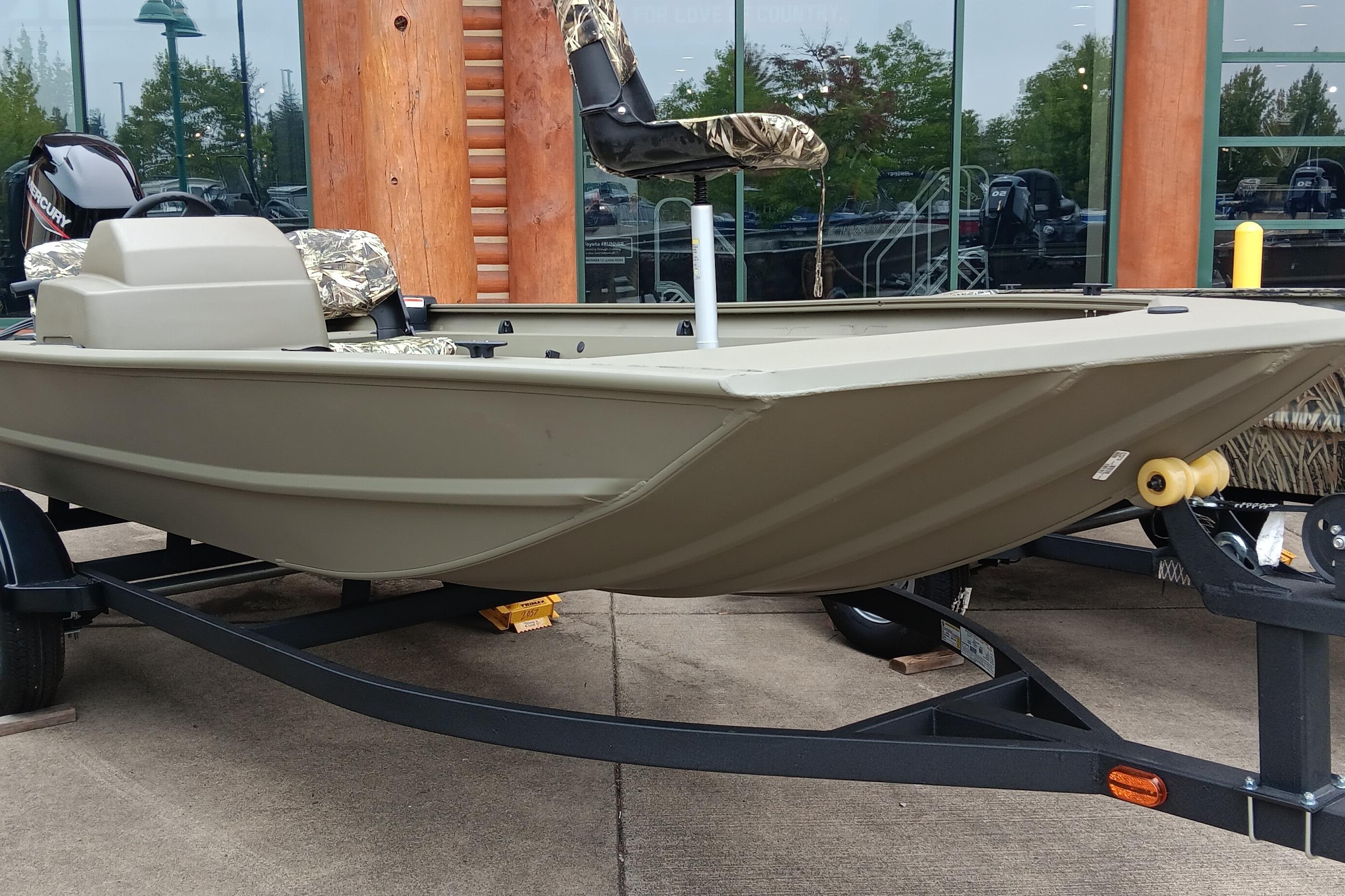 2026 Tracker Grizzly 1754 SC boat on trailer, displayed outdoors.