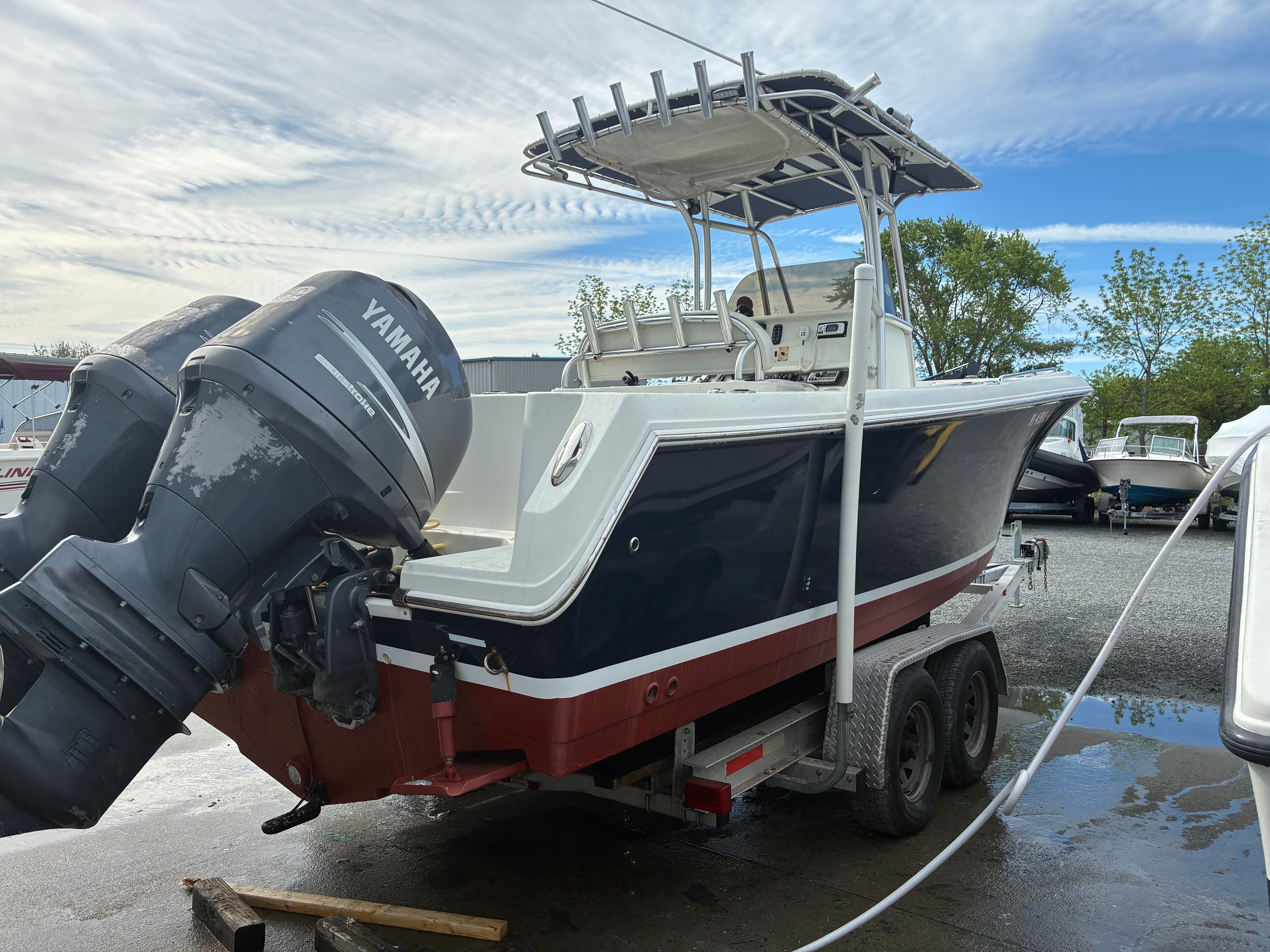 2007 Sailfish 2660 boat with Yamaha engines on trailer.