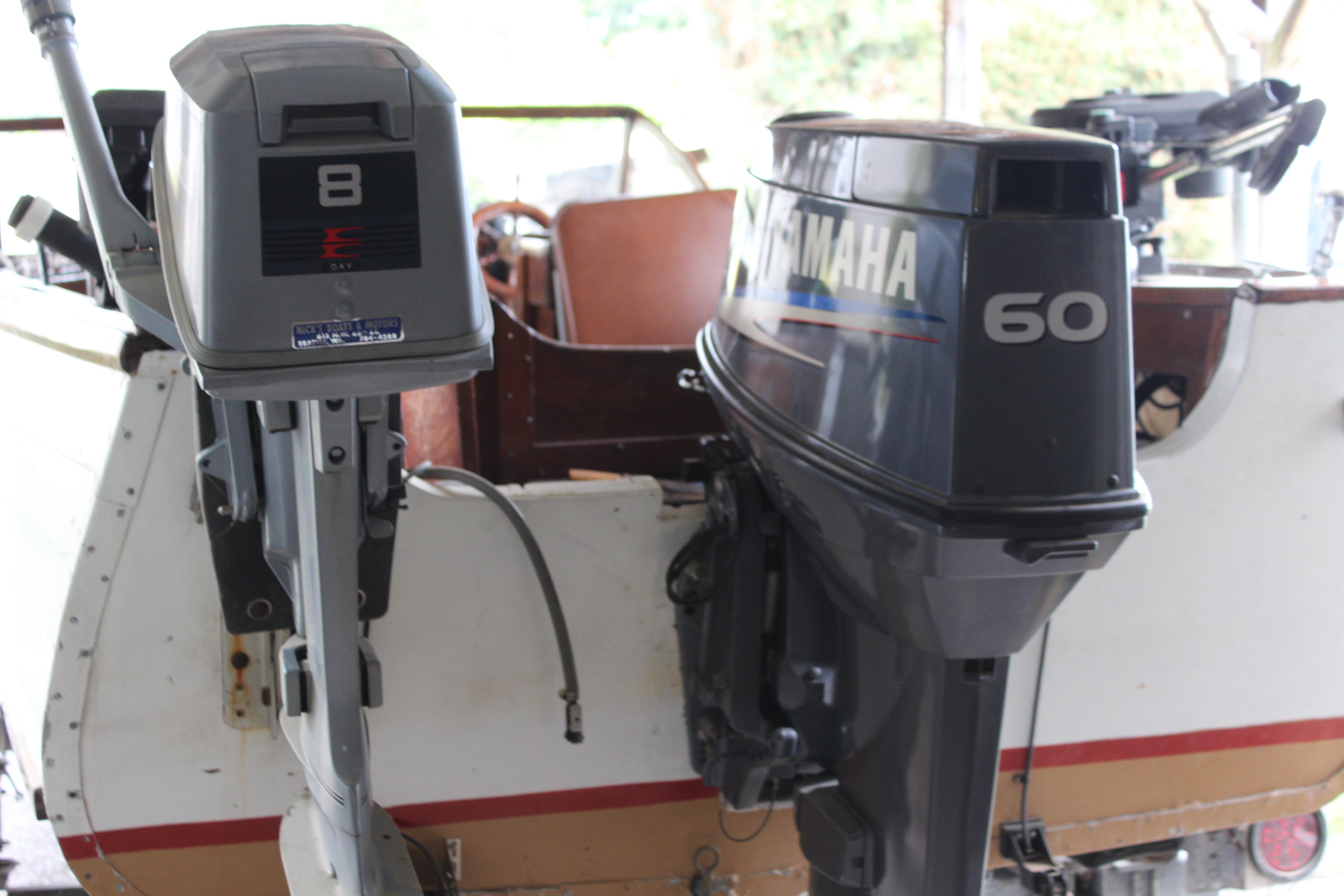 1960 Thompson Fishing boat with dual outboard motors, featuring Yamaha 60 and another motor.