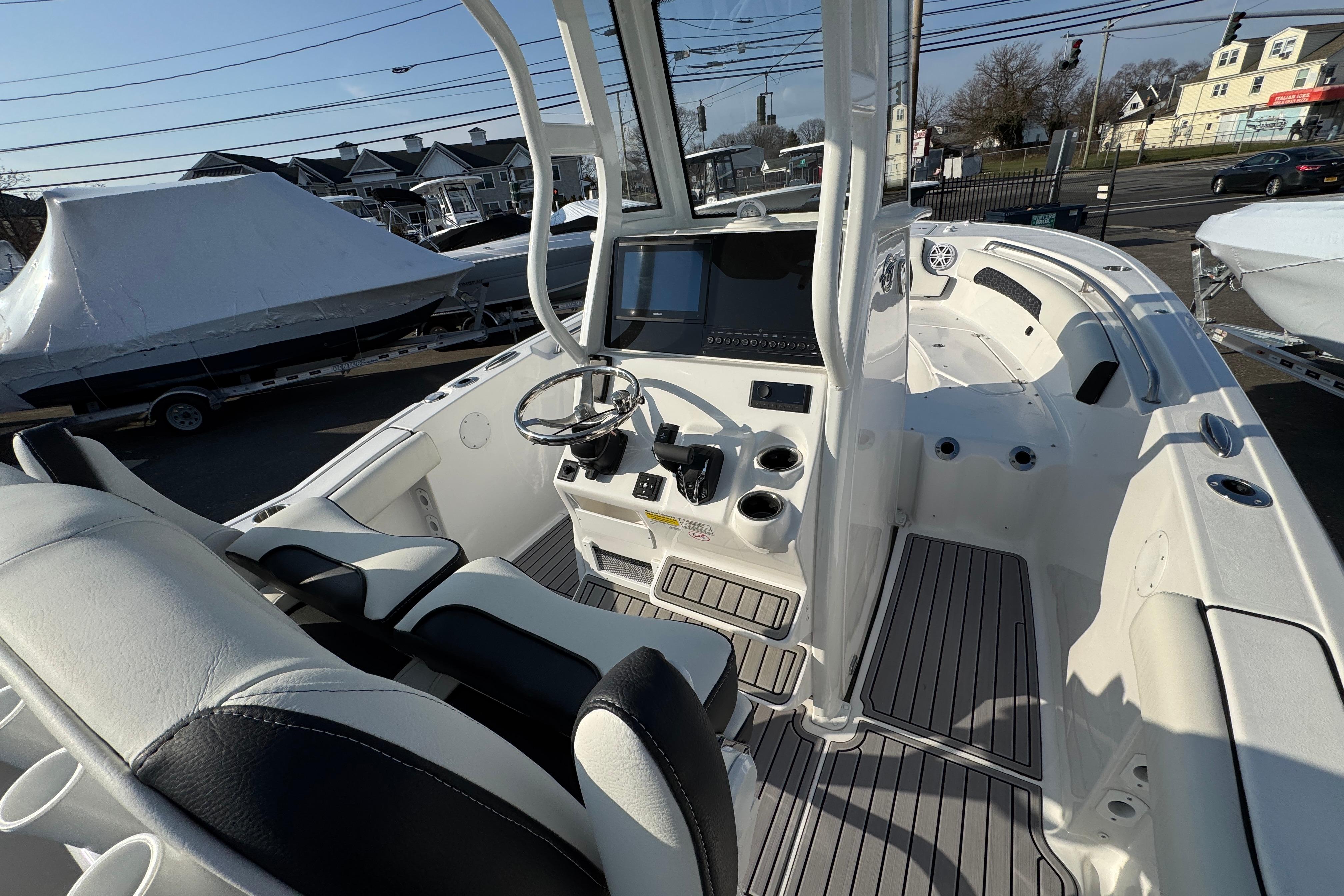 2026 Tidewater 232 SS boat interior with modern helm and seating.