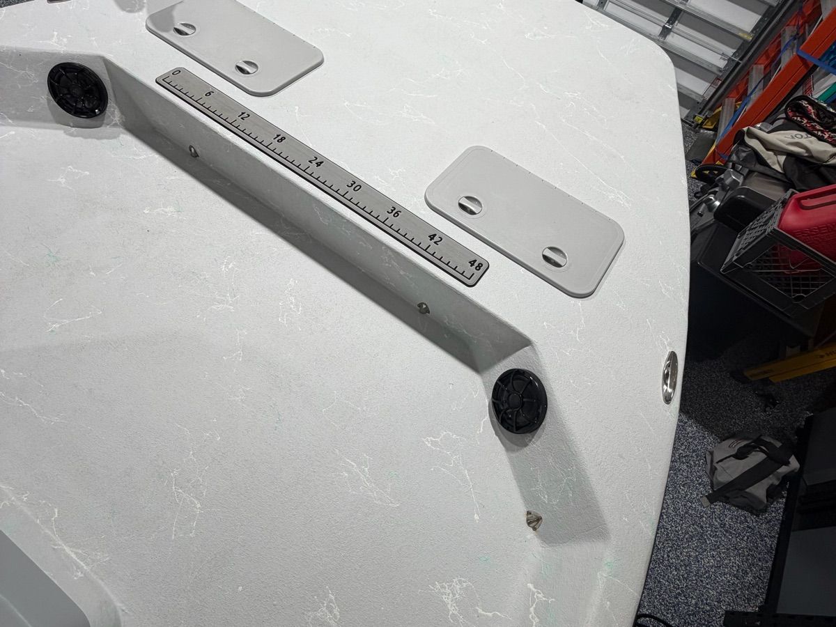 The image shows the deck of a Shoalwater Cat boat with a measuring scale and mounts.