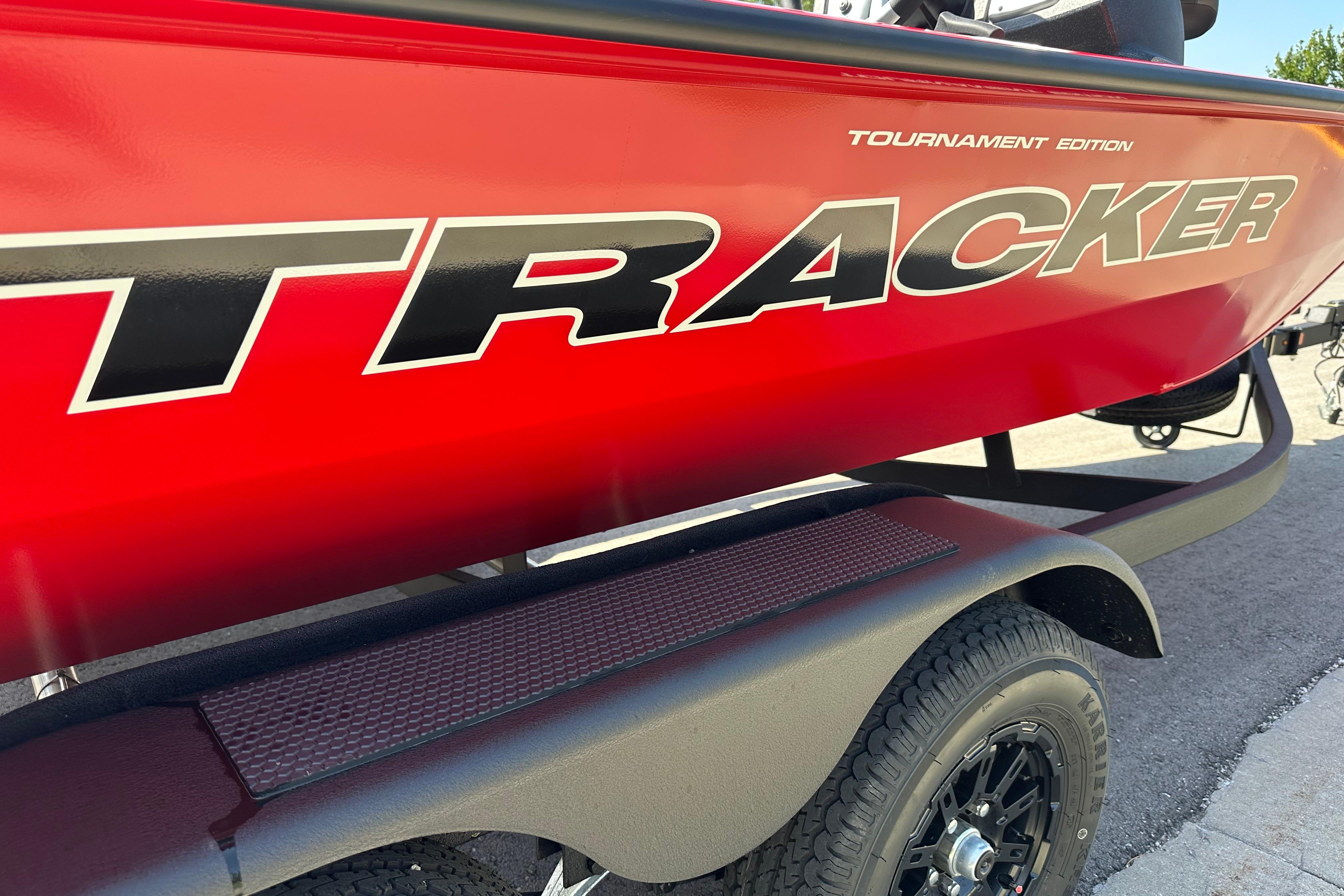 Red 2026 Tracker Pro Team 195 boat, Tournament Edition, on a trailer.