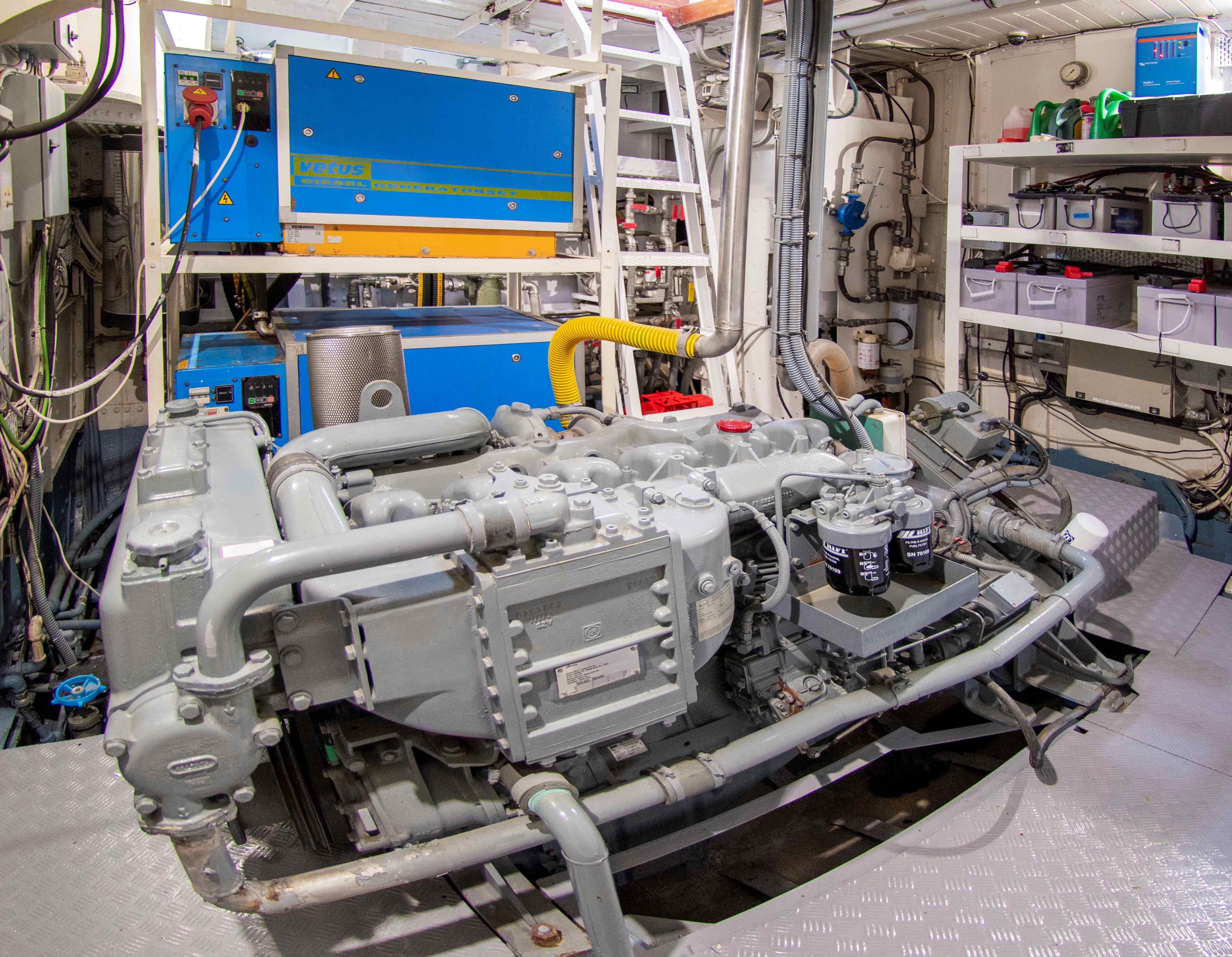 Engine room of 1892 De Vries Lentsch Classic Yacht with machinery and equipment.