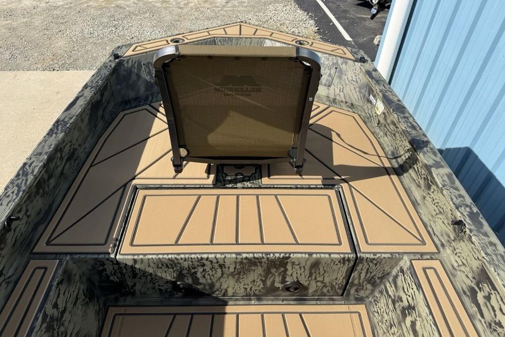 2026 Tracker Grizzly 1650 T Prairie Wings Edition boat interior with camouflage design and seating.