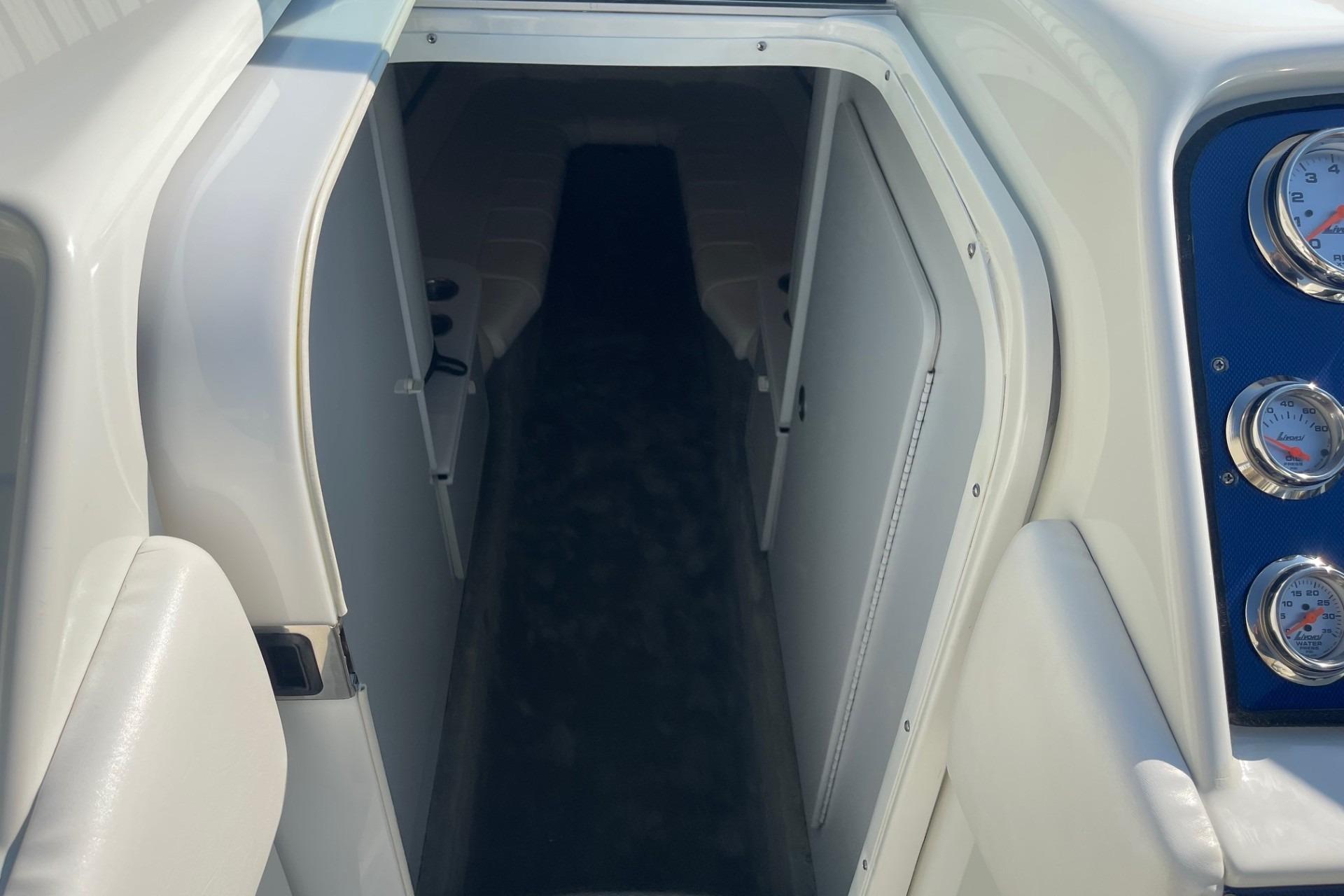 2004 Formula 382 FASTech cabin entrance with visible gauges and sleek interior design.