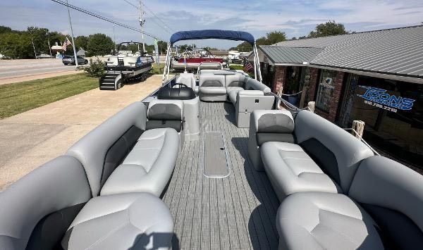 2024 Landau ATLANTIS 230C pontoon boat with gray seating and sunshade.