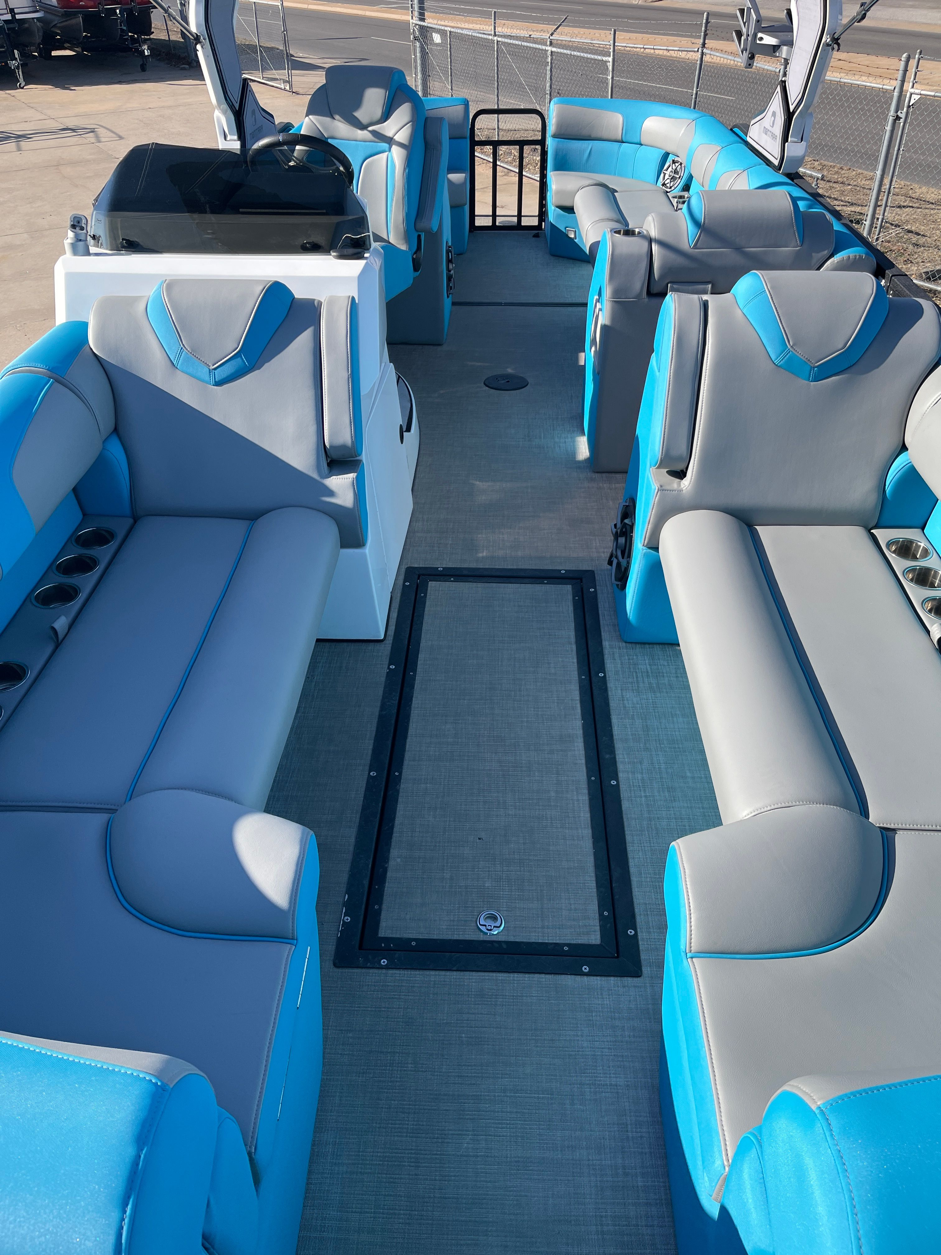 Interior of Montara Surf Boss 2.0 boat, 2023 model, featuring blue and gray seating.