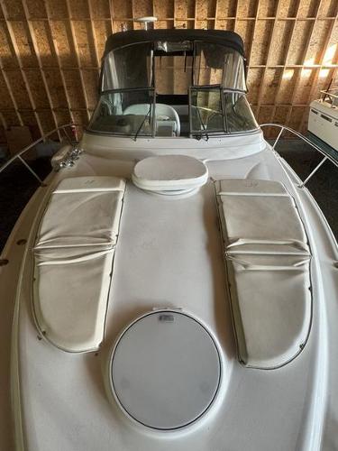 2005 Four Winns 298 Vista boat with cushioned deck, stored indoors.