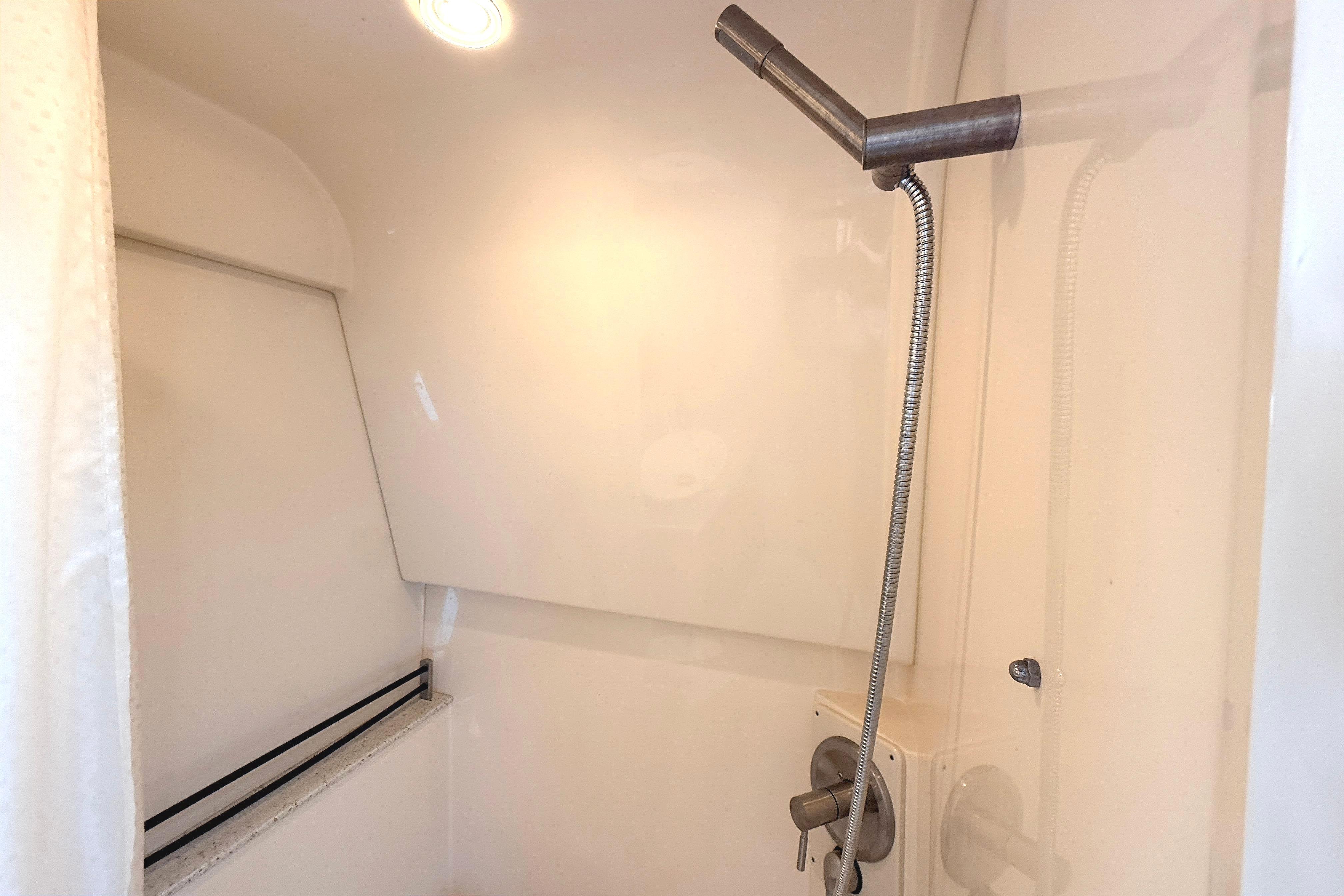 Shower area in 2013 Sea Ray 370 Venture boat with modern fixtures.