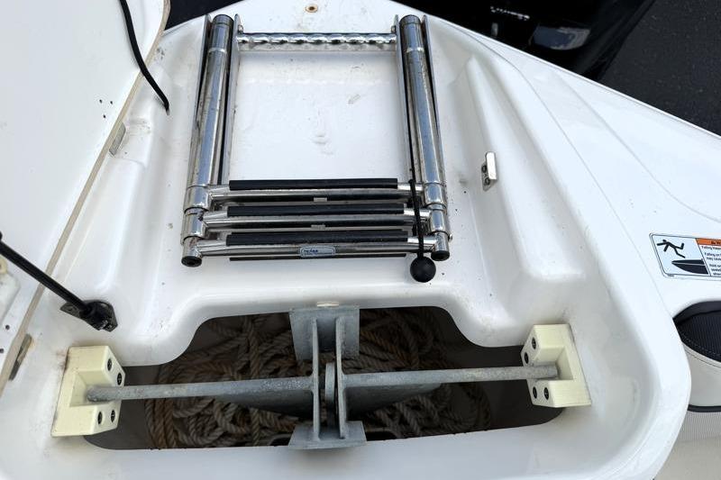 2017 Yamaha Boats SX210 anchor storage with folded ladder and rope.