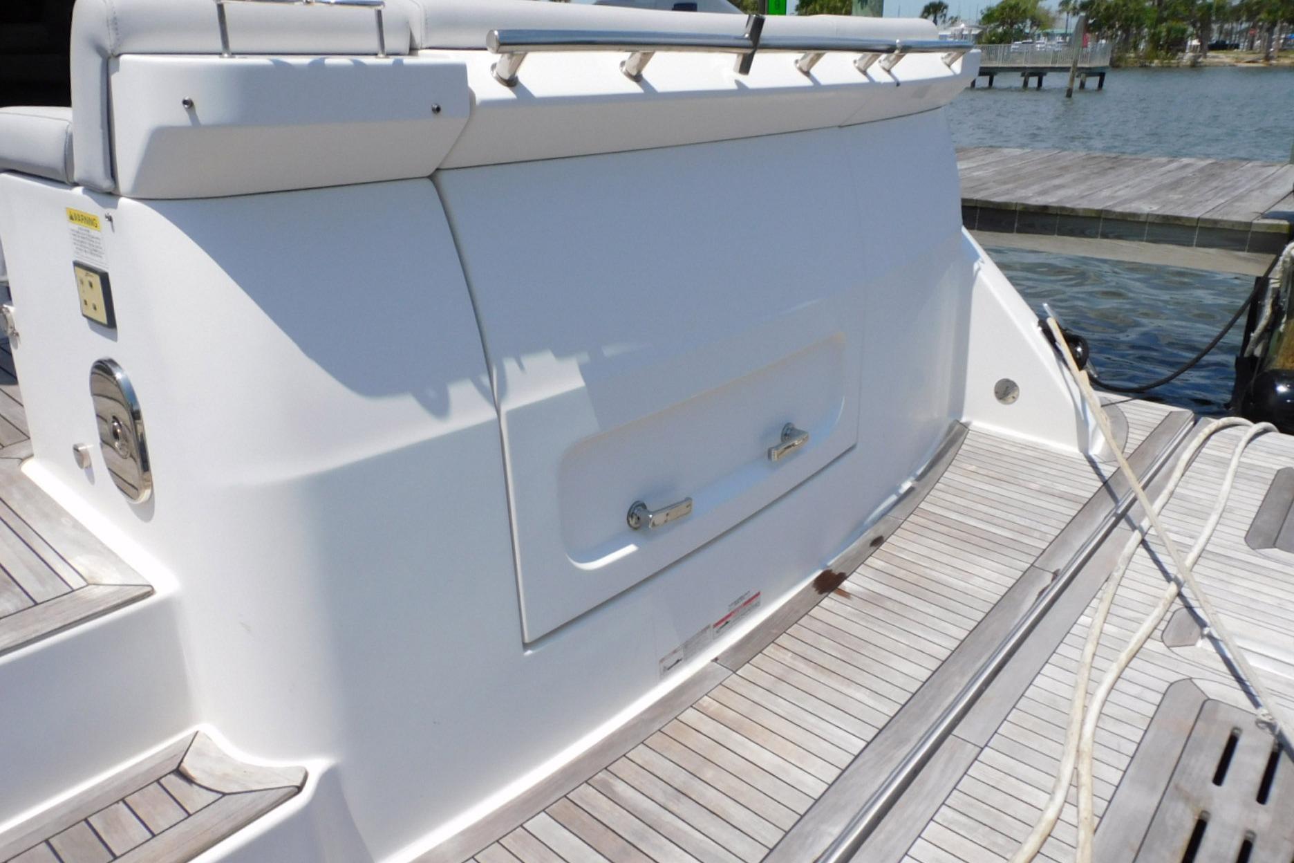 2019 Sea Ray L550 yacht stern view with teak decking and storage compartment.