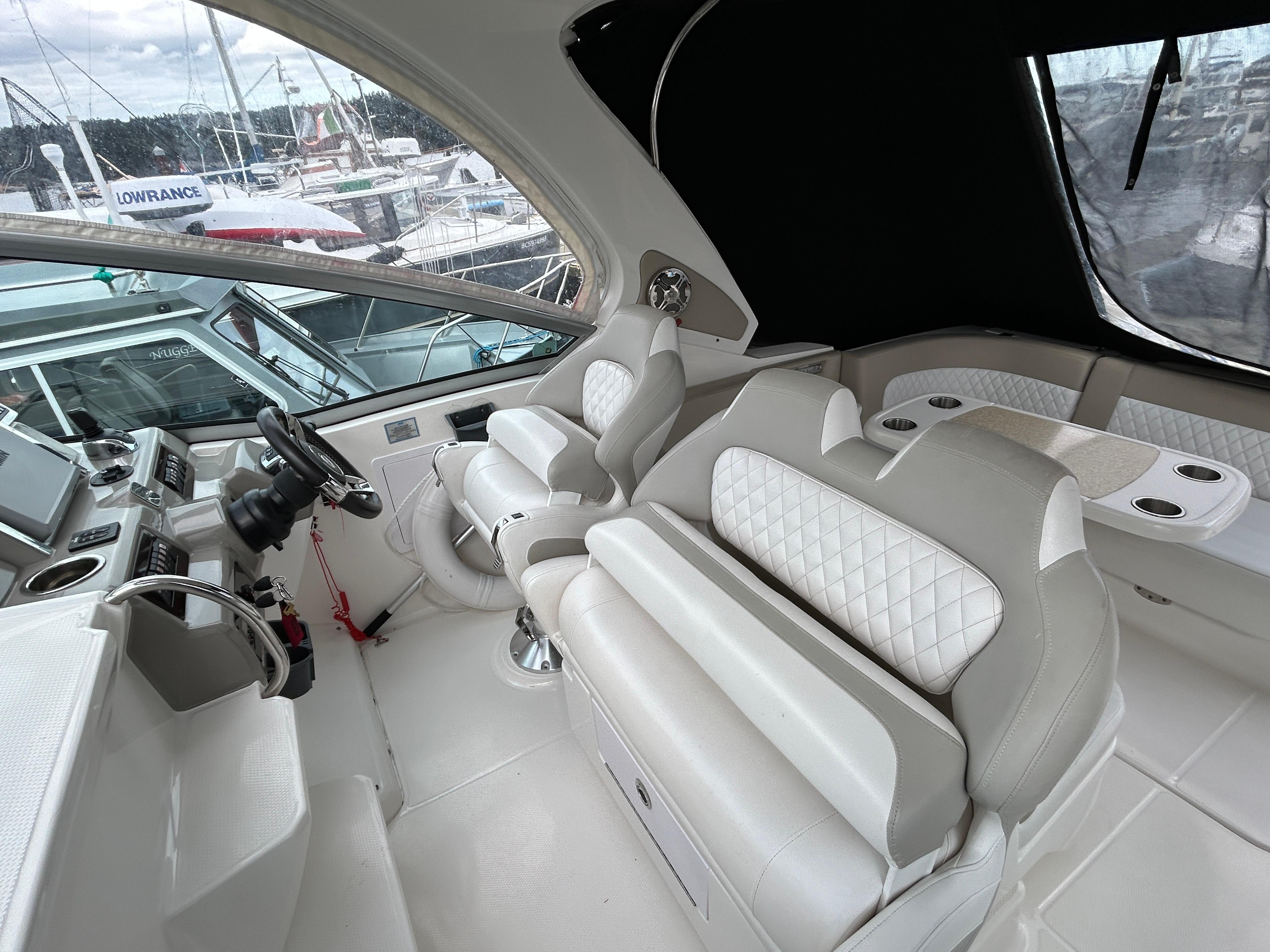2015 Chaparral 330 Signature boat interior with luxurious seating and modern dashboard.