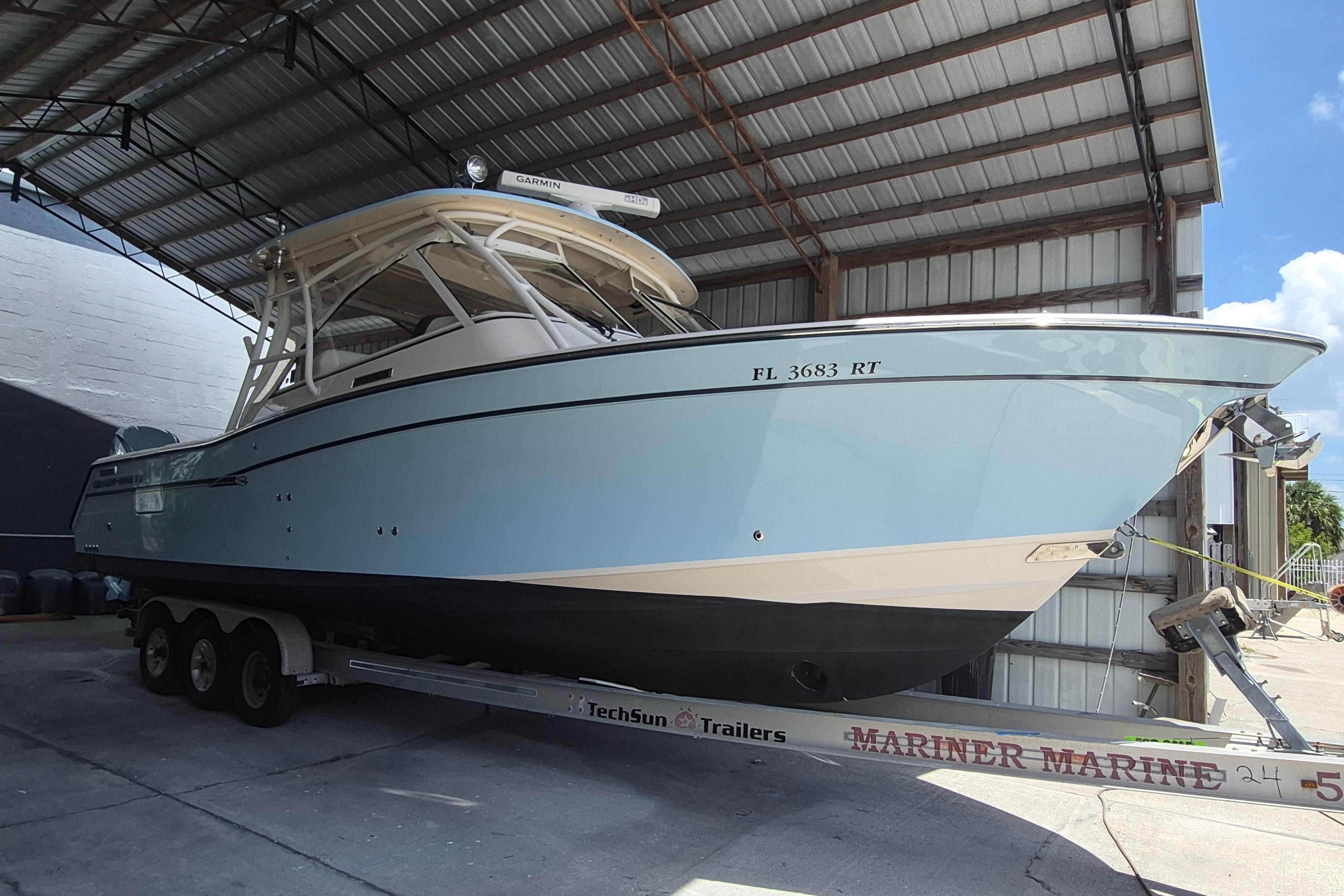 2019 Grady-White Freedom 335 boat on trailer in covered storage area.