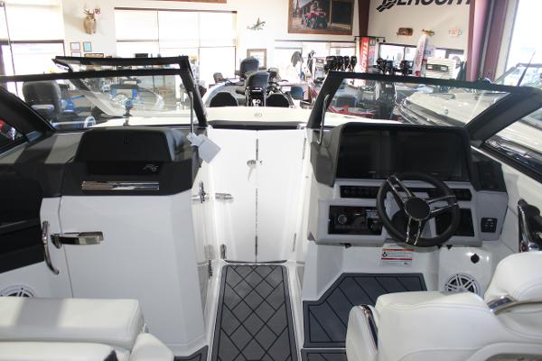 Interior view of 2025 Cobalt R6 boat, featuring modern dashboard and seating.