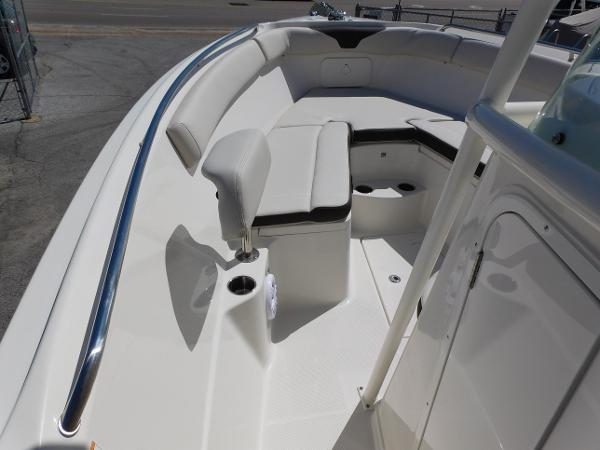 2024 Sailfish 242 CC boat interior with cushioned seating and stainless steel rail.