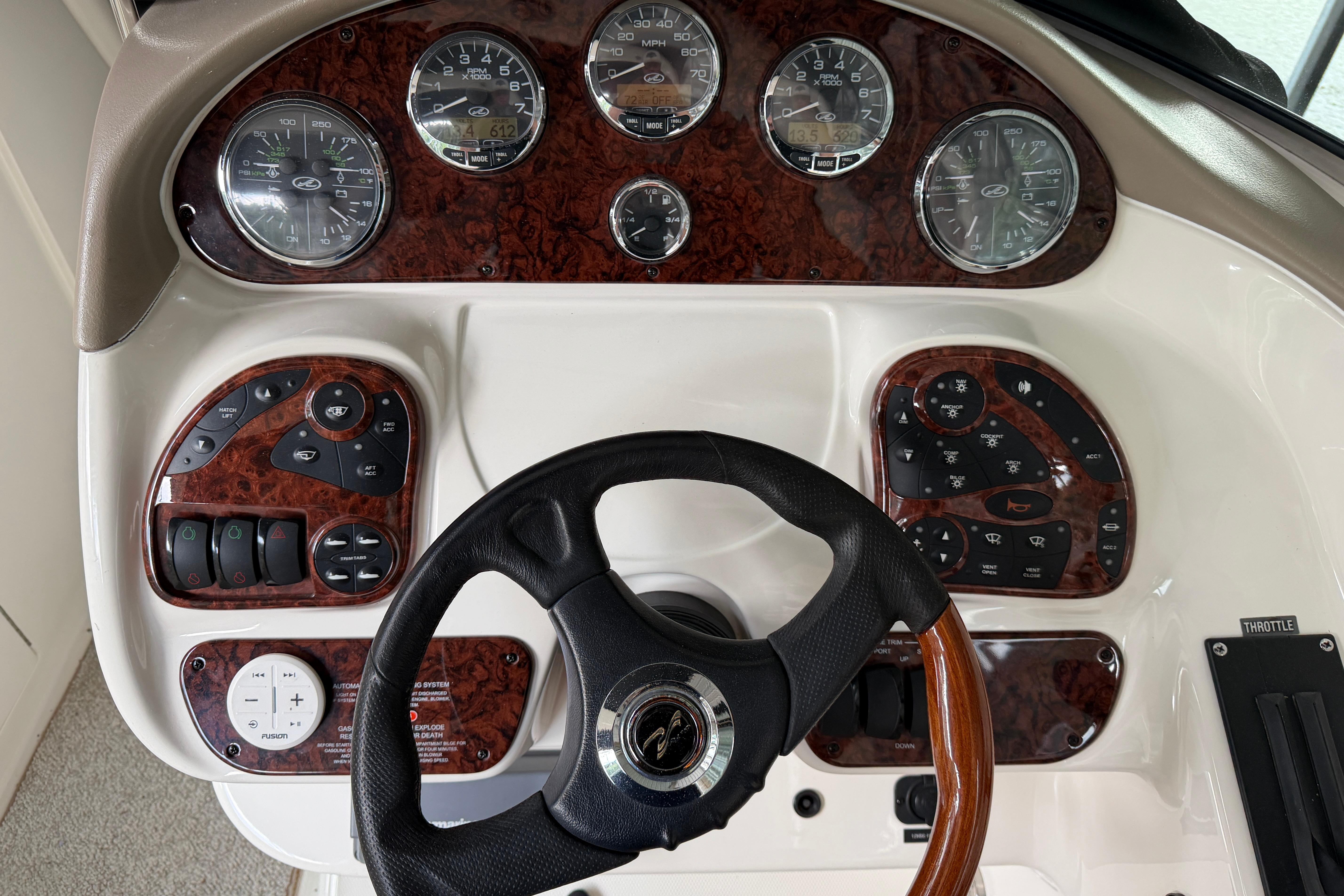 Dashboard of a 2003 Sea Ray 290 Bowrider with gauges and controls.