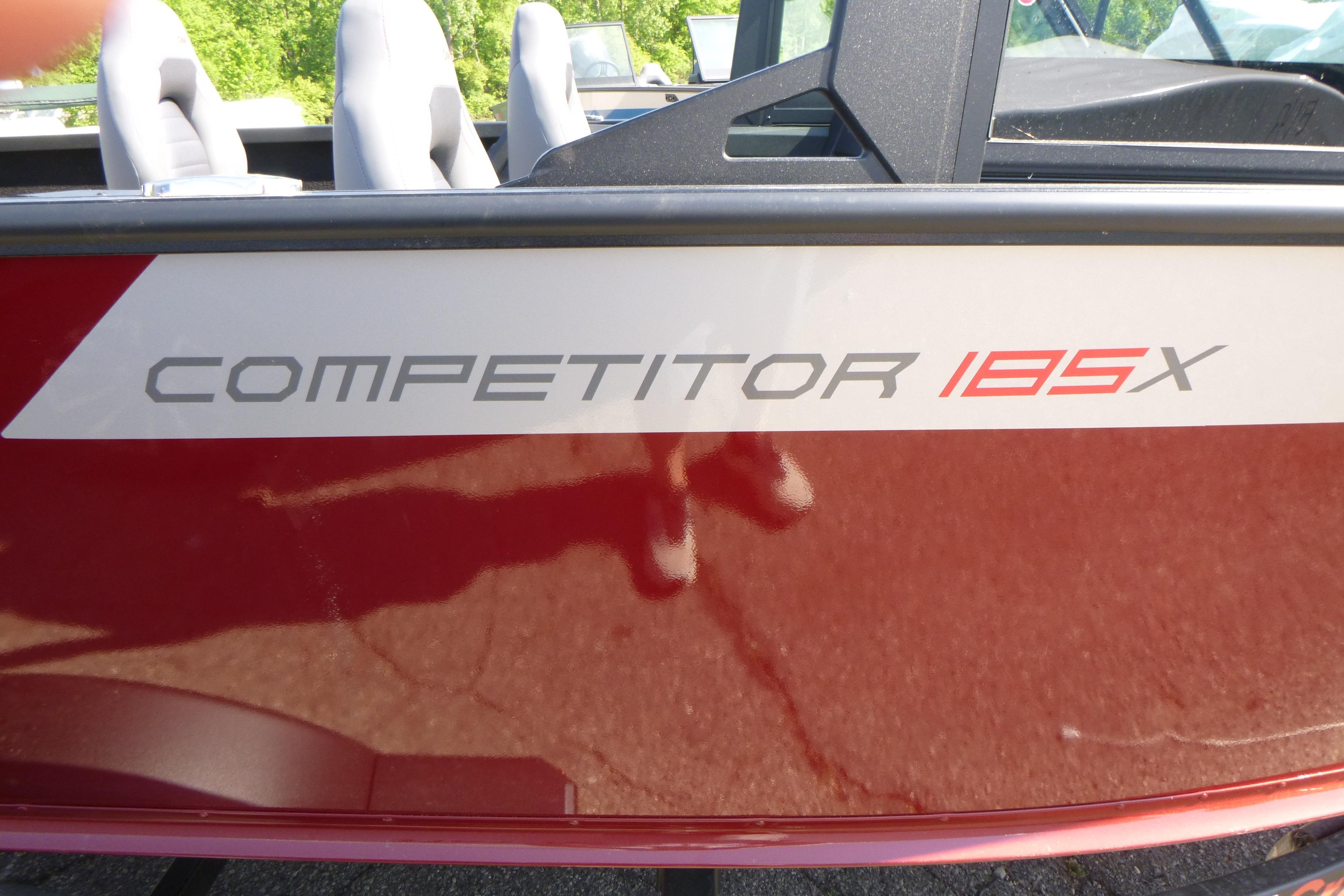 2024 Alumacraft Competitor 185X Sport boat, red exterior with model name displayed.